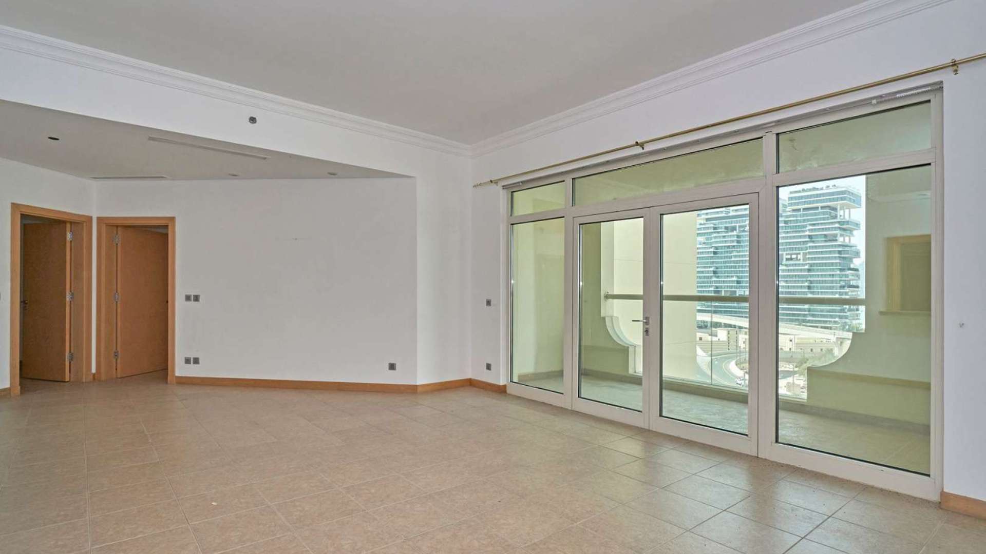 Spacious living room in 2-bedroom apartment, Al Khudrawi, Palm Jumeirah, with large windows