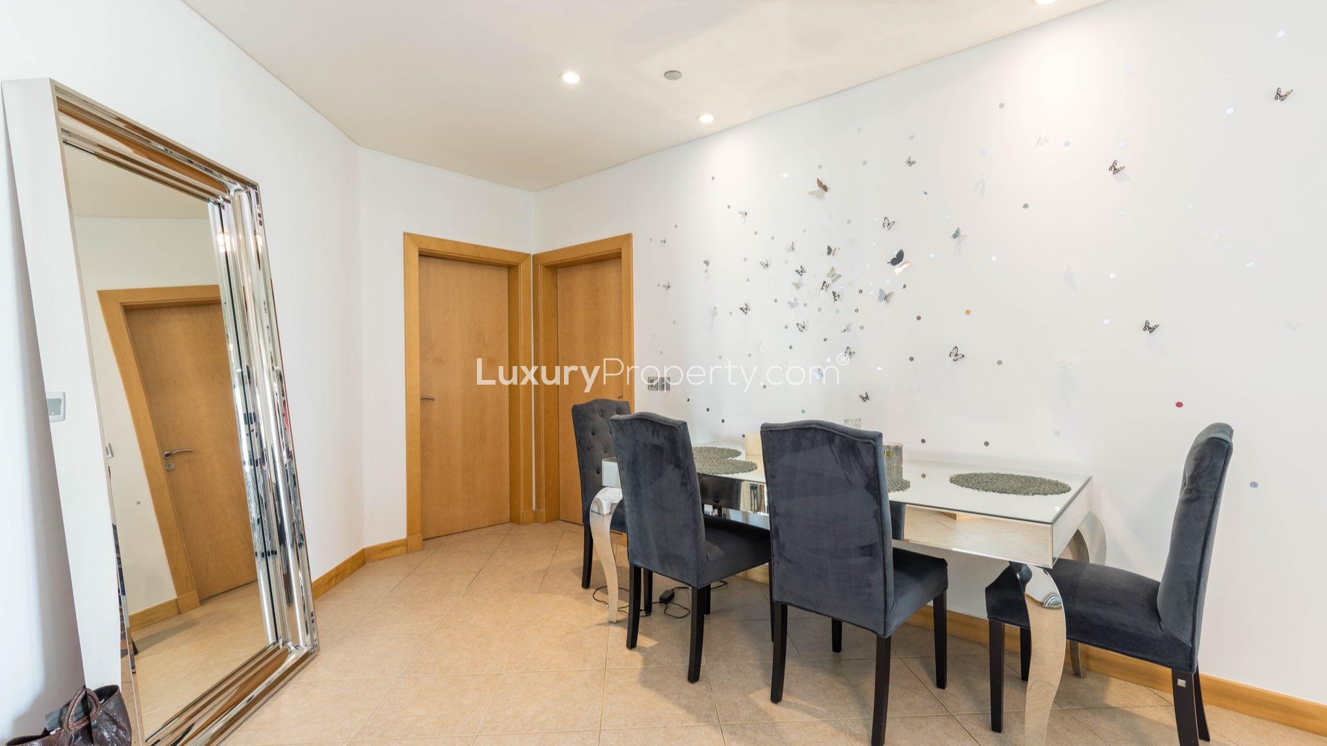 Mid-floor apartment living room with balcony view in Shoreline Apartments, Palm Jumeirah