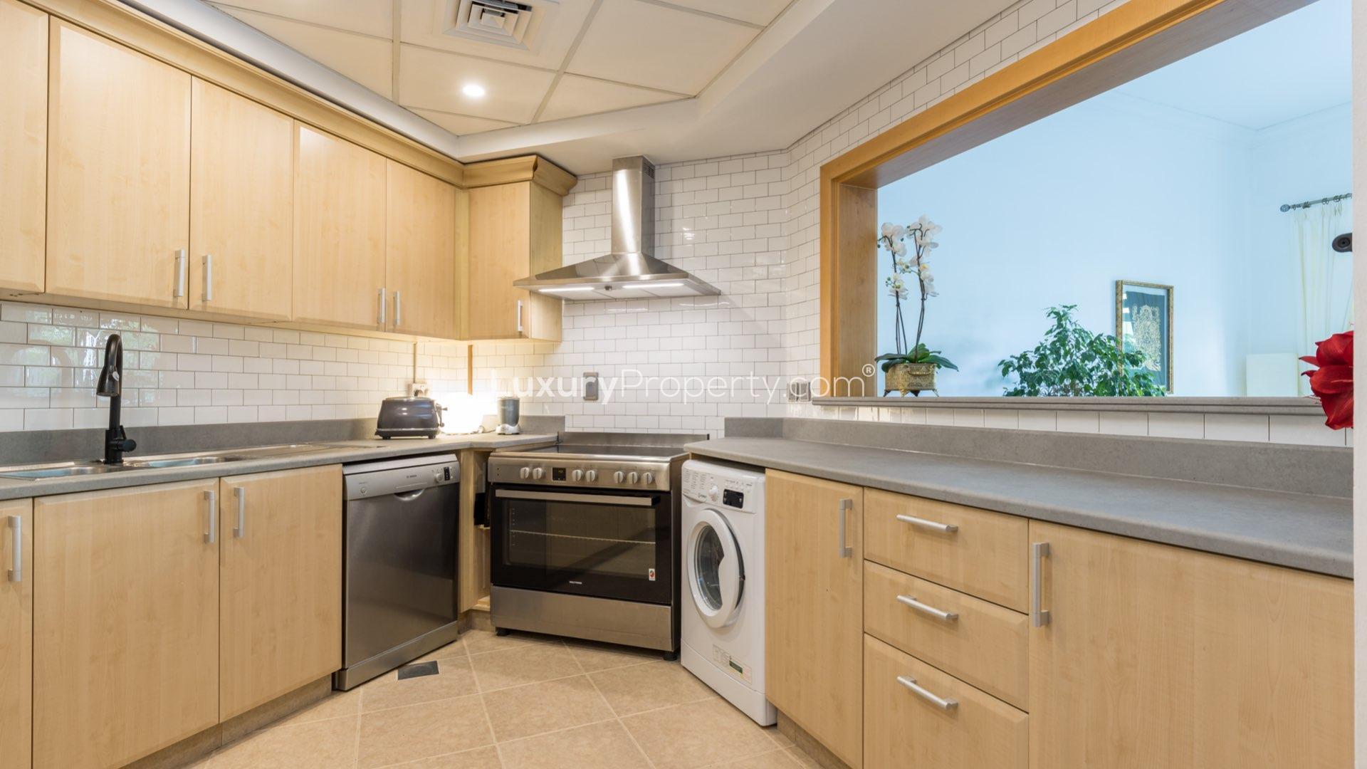 Upgraded kitchen in 2-bedroom Shoreline apartment, Palm Jumeirah, with modern appliances and cabinetry