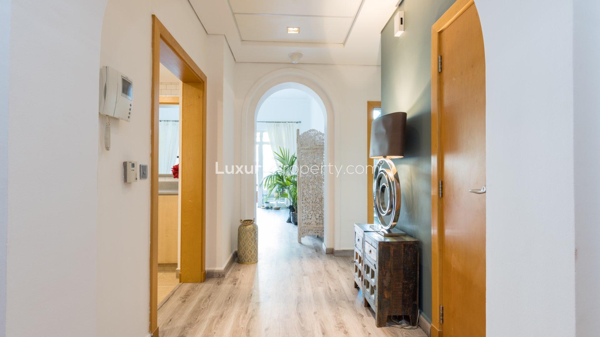 Upgraded living room with balcony, park views in Shoreline, Palm Jumeirah apartment