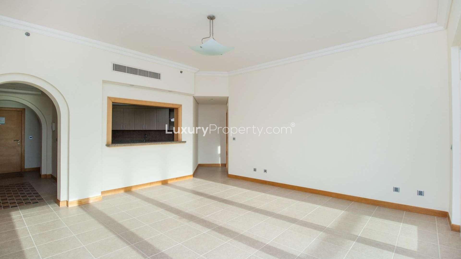 Balcony view of Shoreline Apartments, Palm Jumeirah, overlooking lush park and nearby buildings