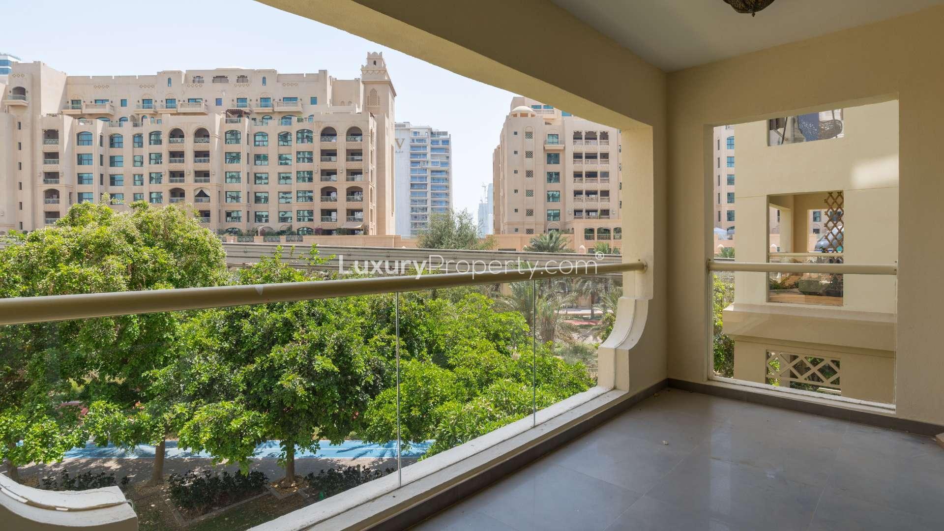 Hallway with wooden doors in 2-bedroom Shoreline apartment, Palm Jumeirah for sale