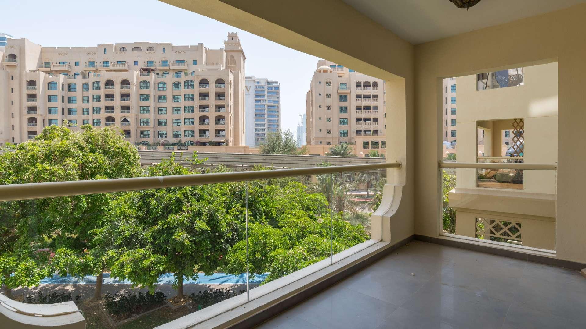 Hallway with wooden doors in 2-bedroom Shoreline apartment, Palm Jumeirah for sale