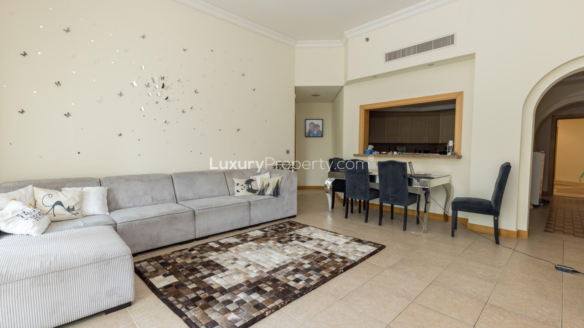 Balcony view from Shoreline Apartment in Palm Jumeirah, surrounded by lush greenery