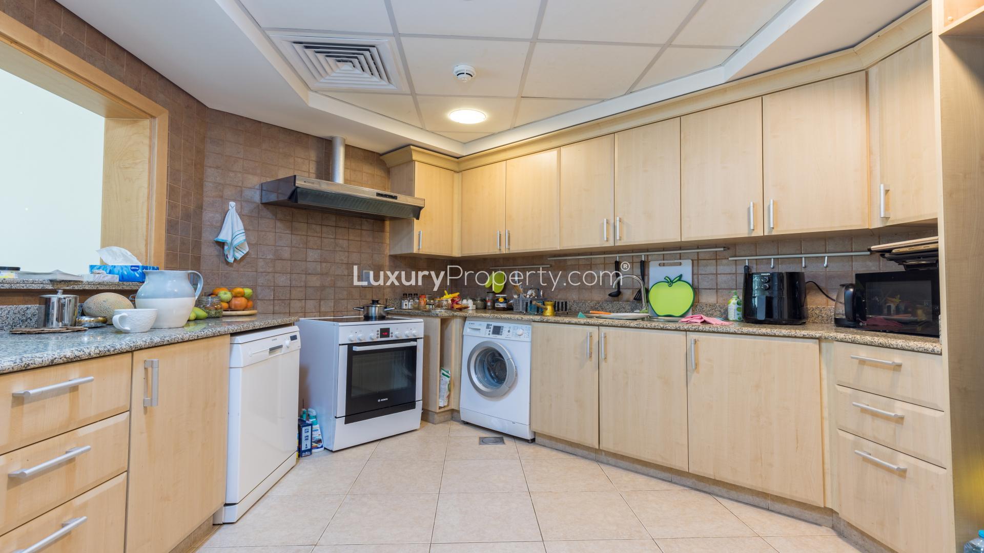 Modern living room in Palm Jumeirah apartment, featuring elegant decor and spacious seating area