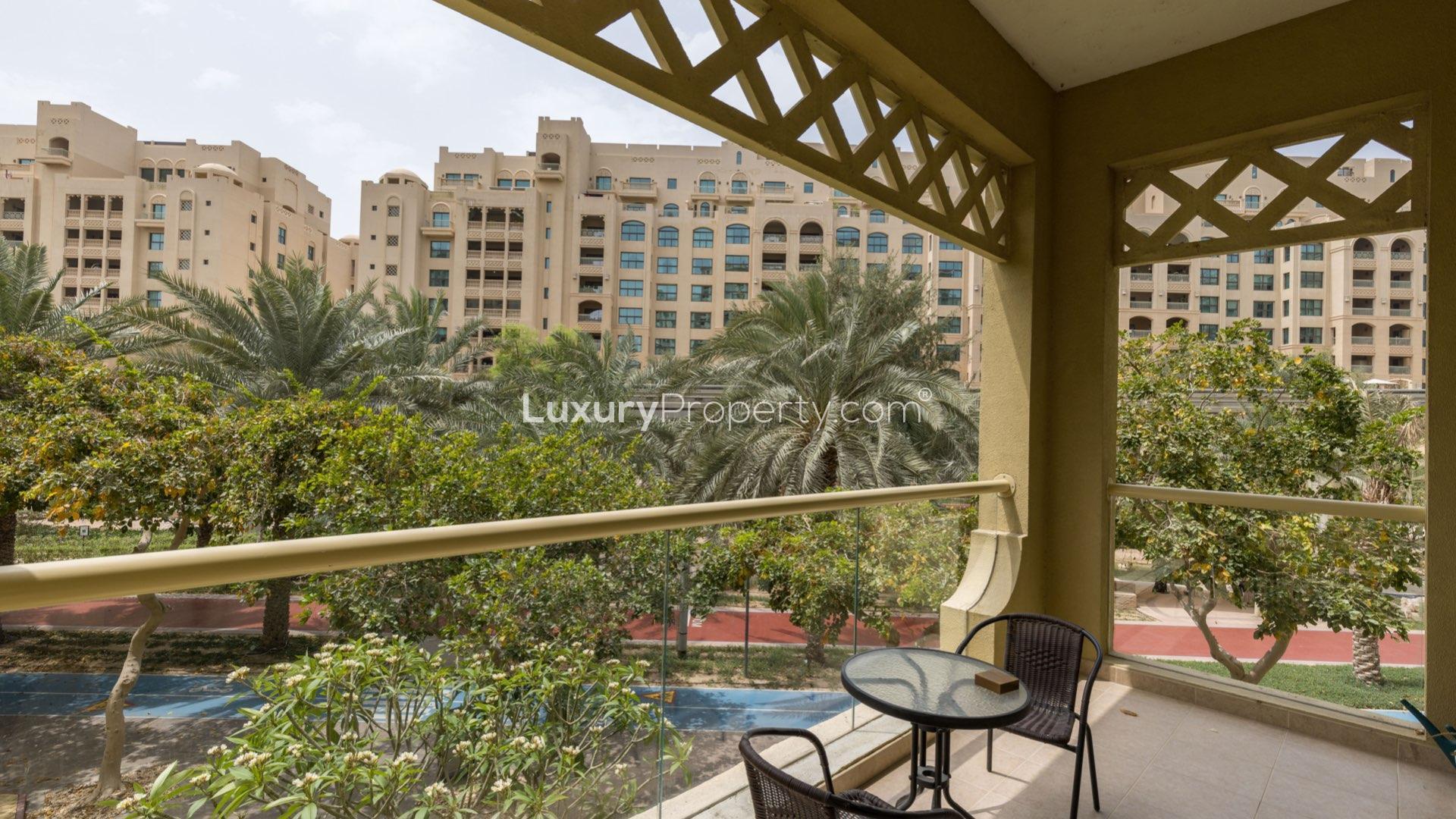 Modern living room in Palm Jumeirah apartment with balcony view, Shoreline Apartments