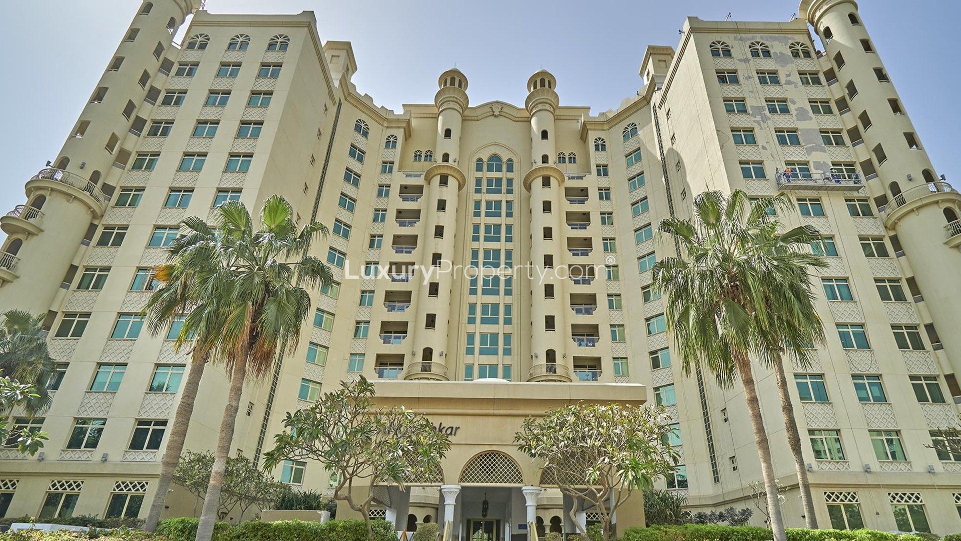 Living room in two-bed apartment, Shoreline Residences, Palm Jumeirah, with modern decor and balcony view