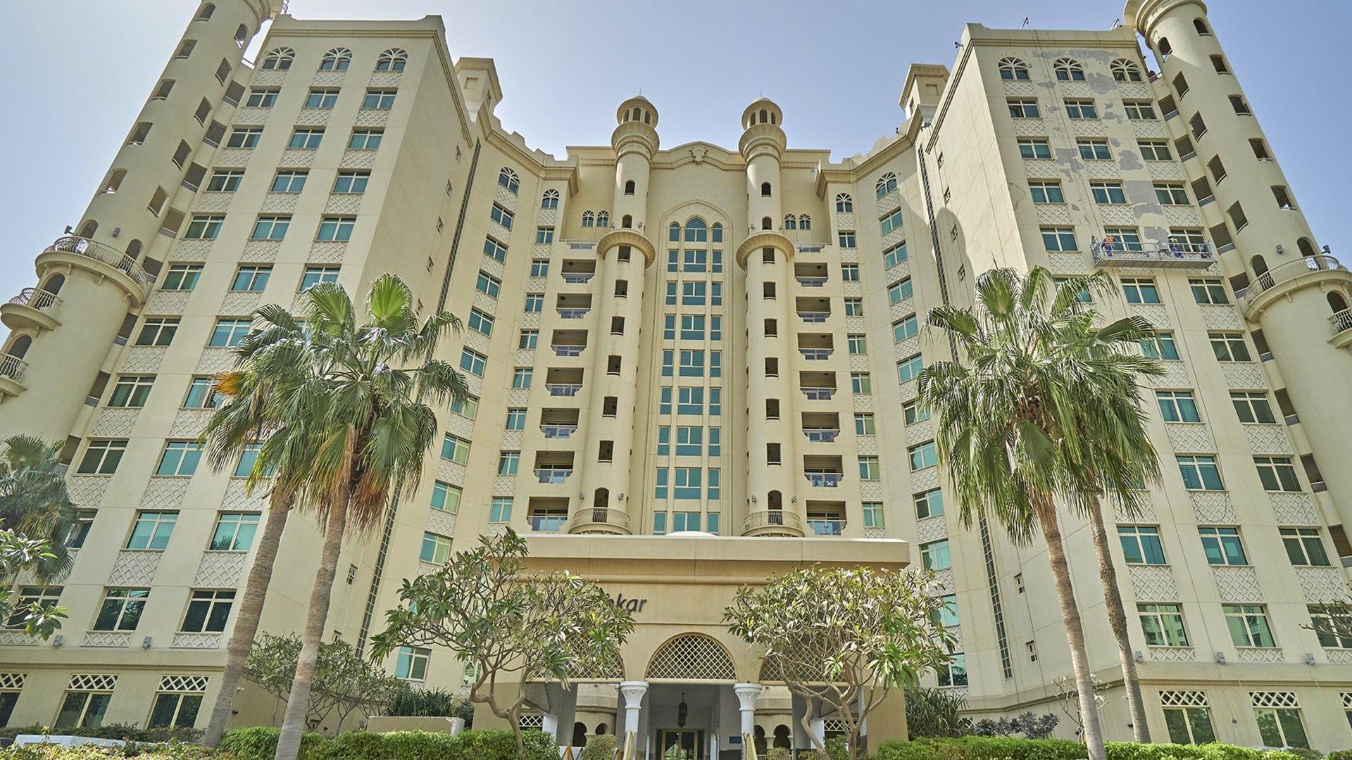 Living room in two-bed apartment, Shoreline Residences, Palm Jumeirah, with modern decor and balcony view