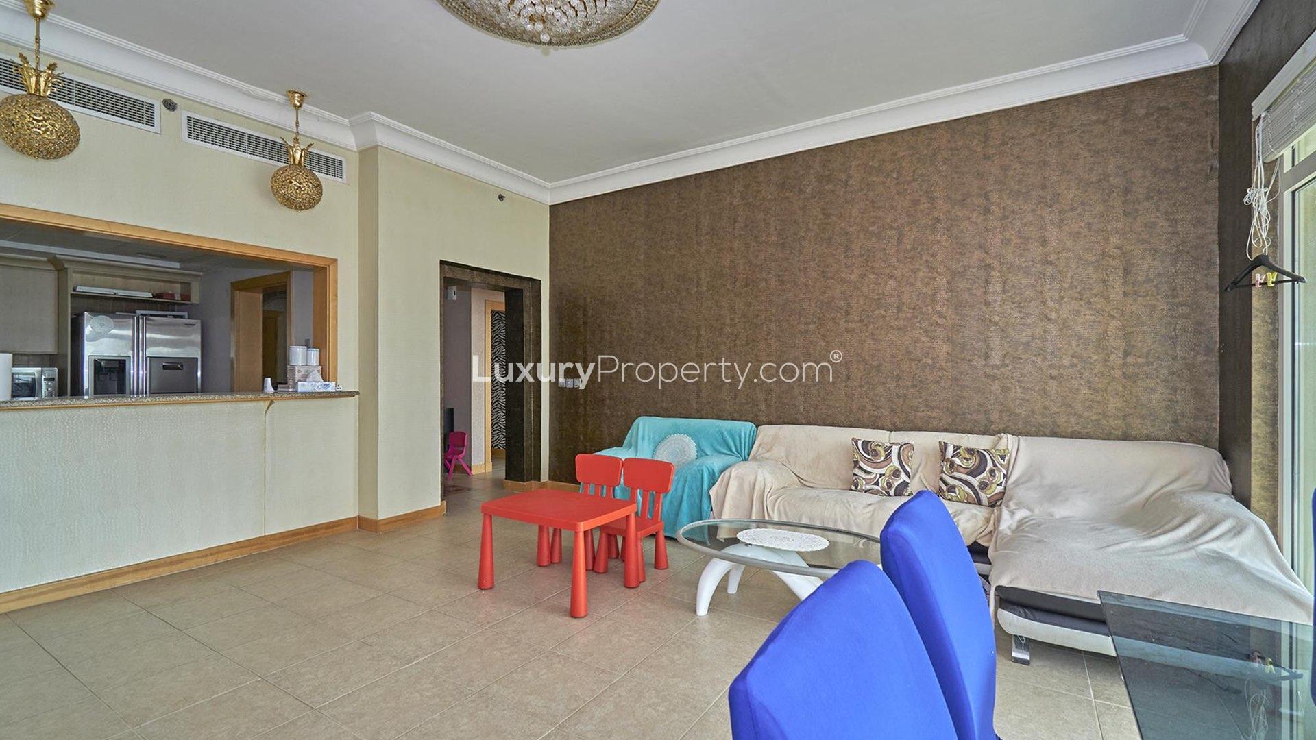 Living room in two-bed apartment, Shoreline Residences, Palm Jumeirah, with city view balcony