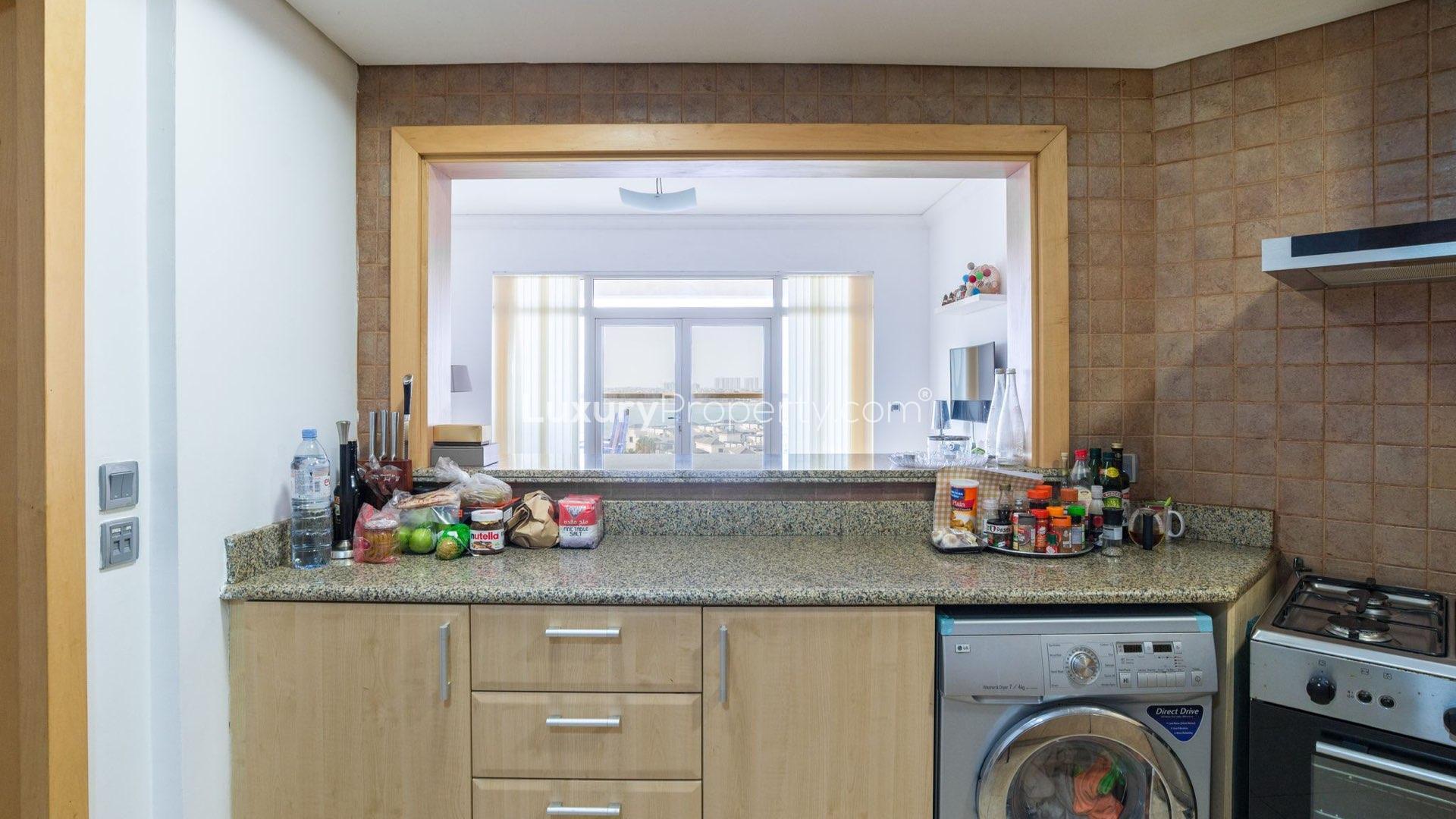 Modern living room in Palm Jumeirah apartment with sea view balcony and stylish decor