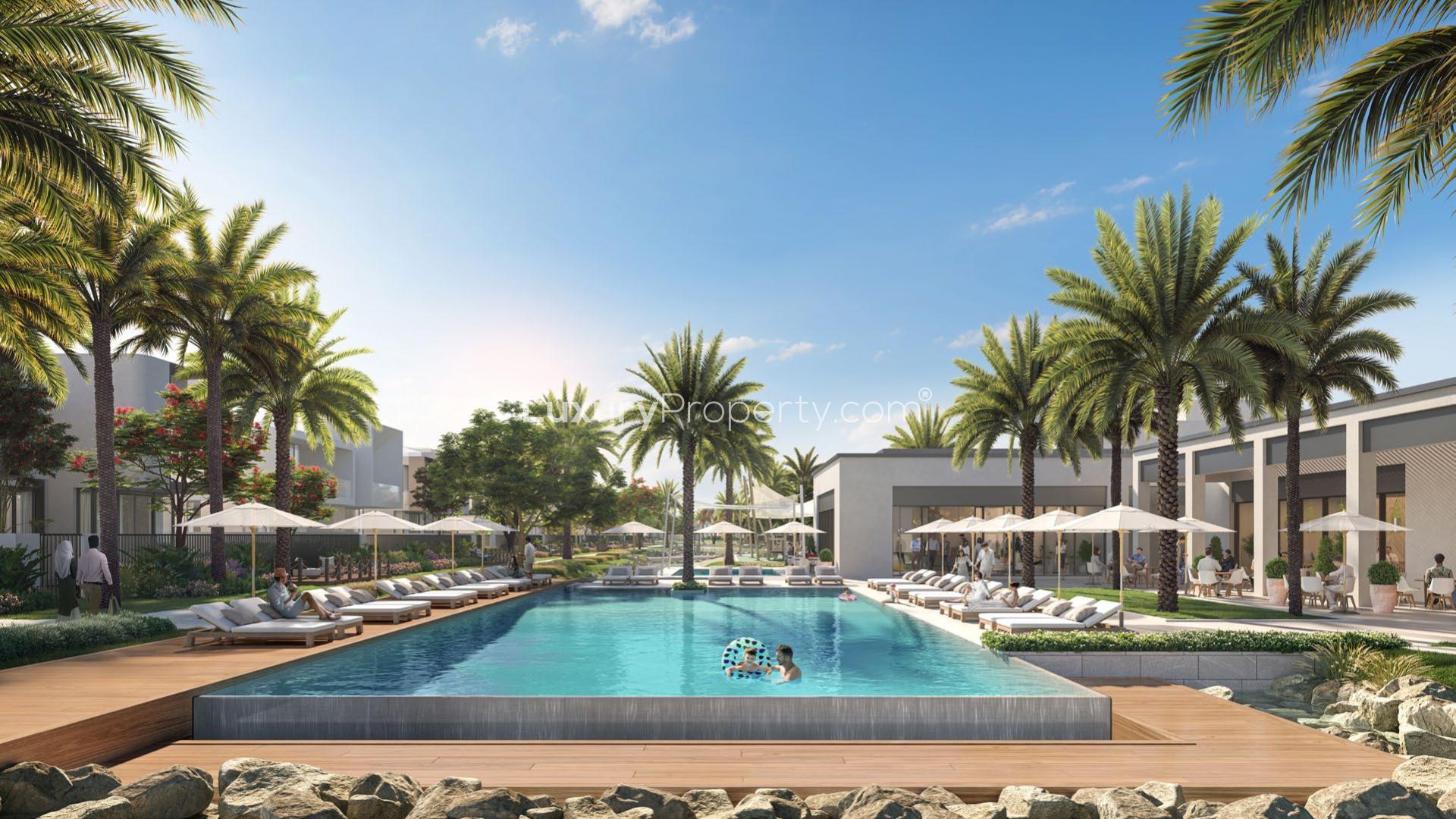 Luxurious poolside view at Shoreline Apartments, Palm Jumeirah with palm trees and loungers