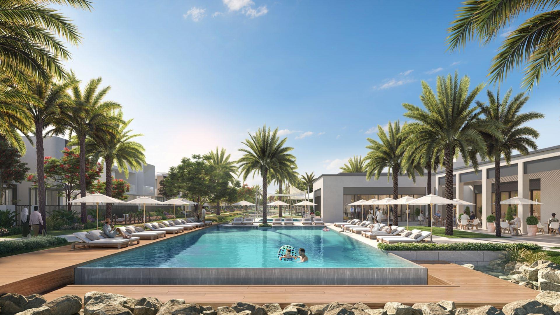 Luxurious poolside view at Shoreline Apartments, Palm Jumeirah with palm trees and loungers