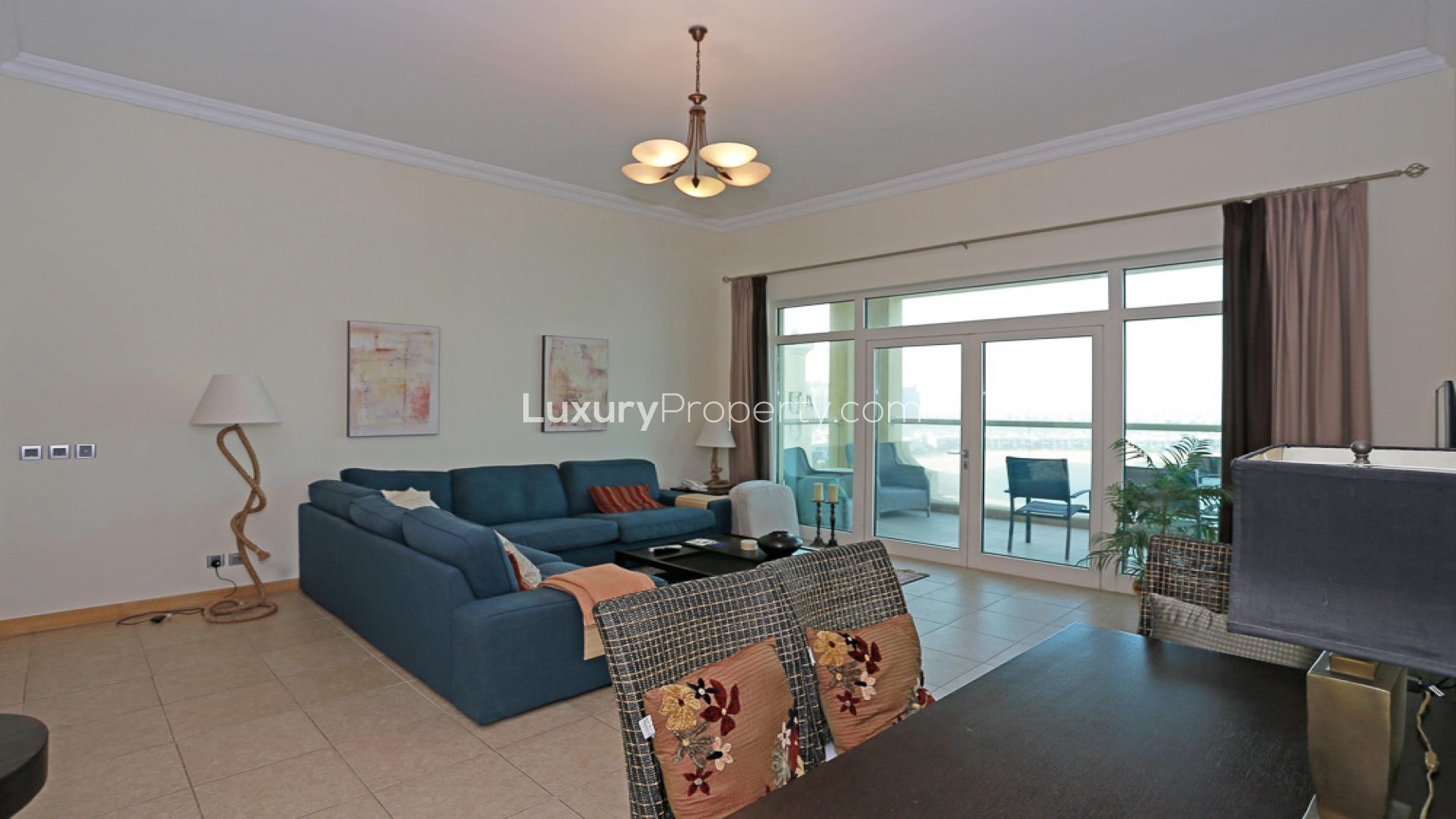 "Stunning full sea view from high-floor apartment in Shoreline Apartments, Palm Jumeirah.",High-floor apartment living room with sea views in Shoreline Apartments, Palm Jumeirah