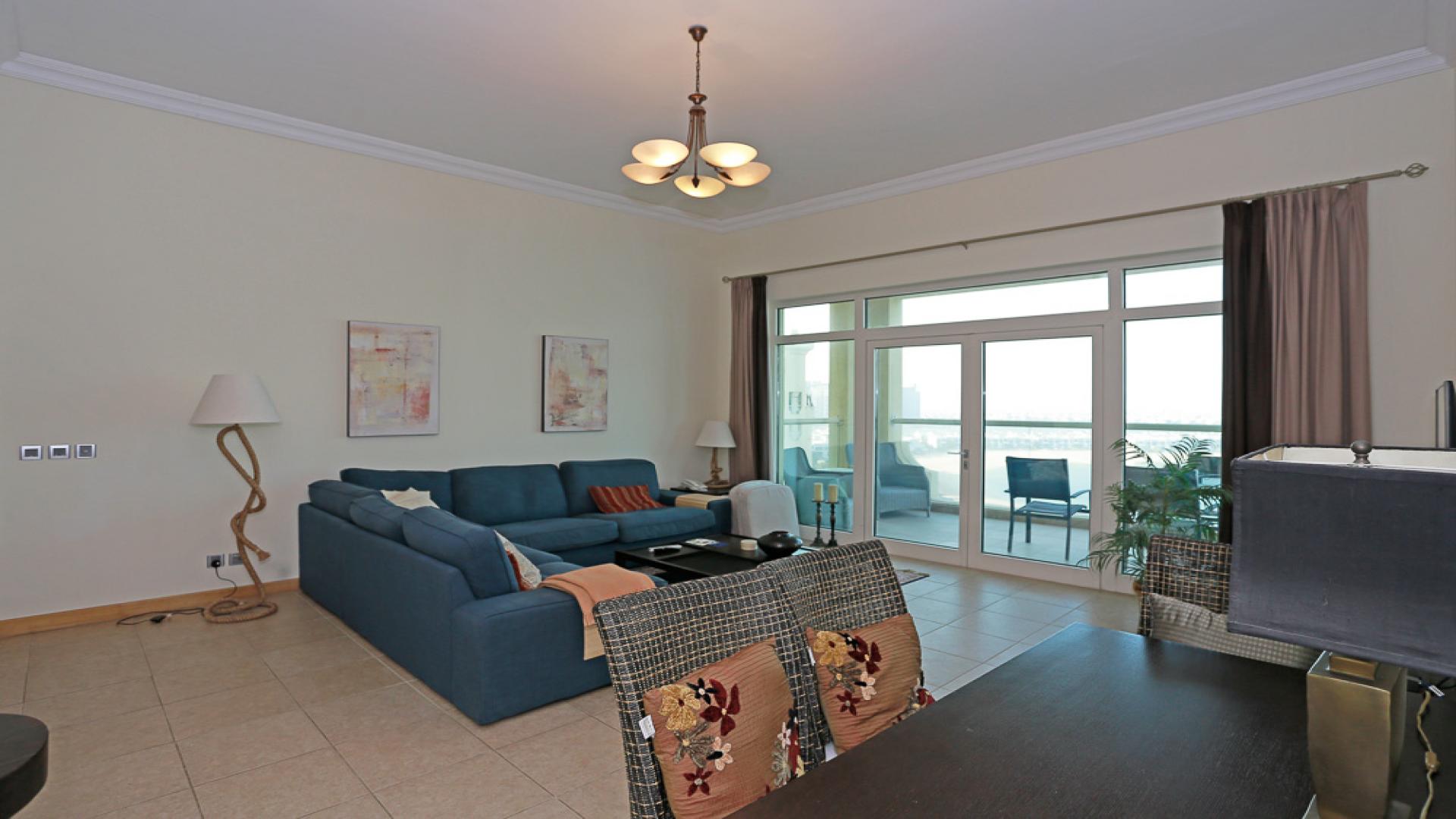 "Stunning full sea view from high-floor apartment in Shoreline Apartments, Palm Jumeirah.",High-floor apartment living room with sea views in Shoreline Apartments, Palm Jumeirah