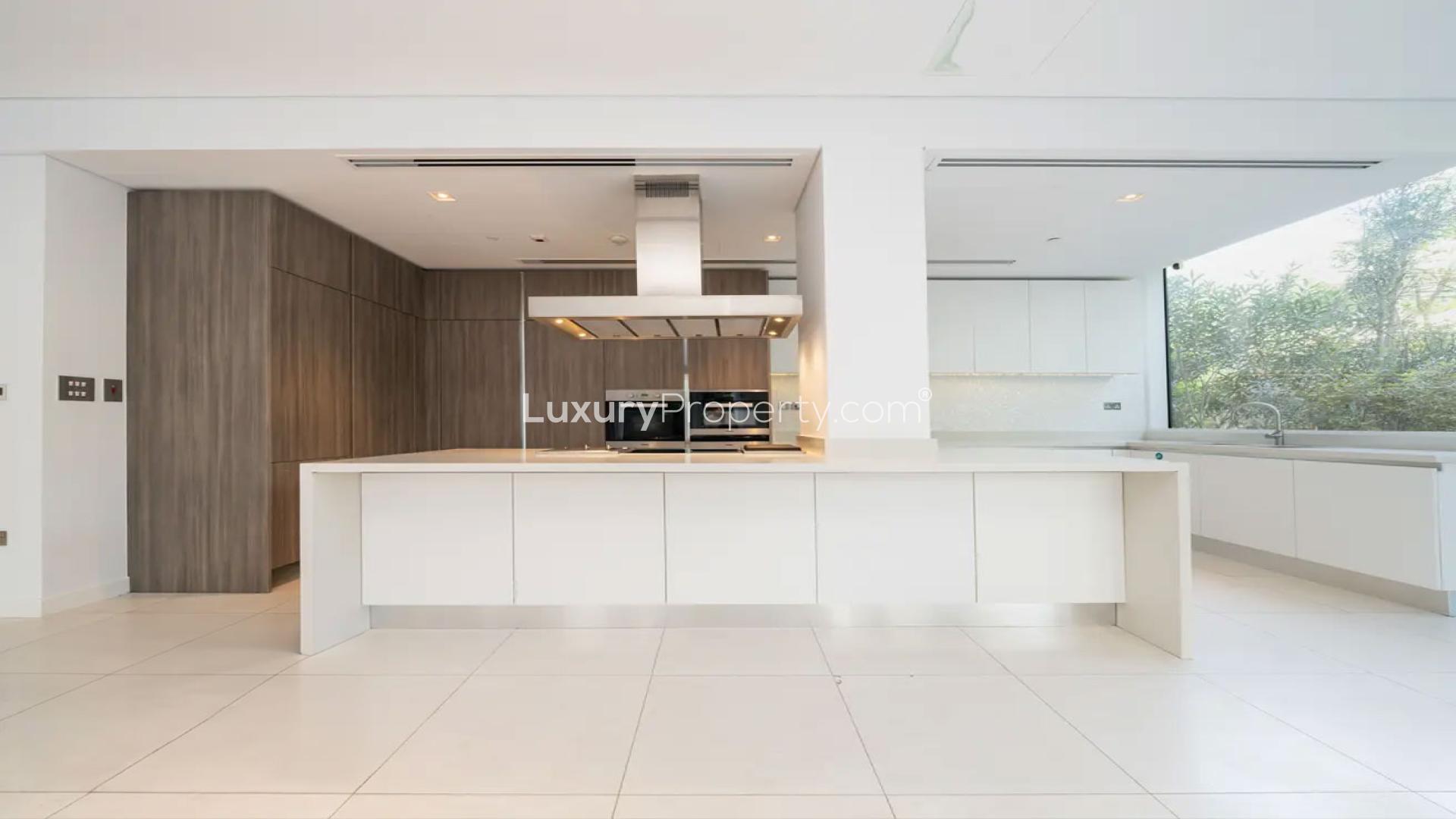 Spacious open-plan kitchen and dining area in Ashjar apartment, Al Barari for rent