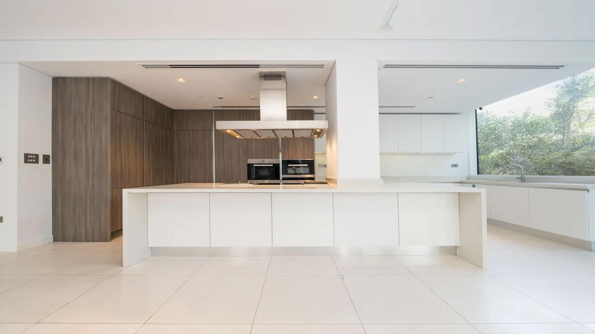 Spacious open-plan kitchen and dining area in Ashjar apartment, Al Barari for rent