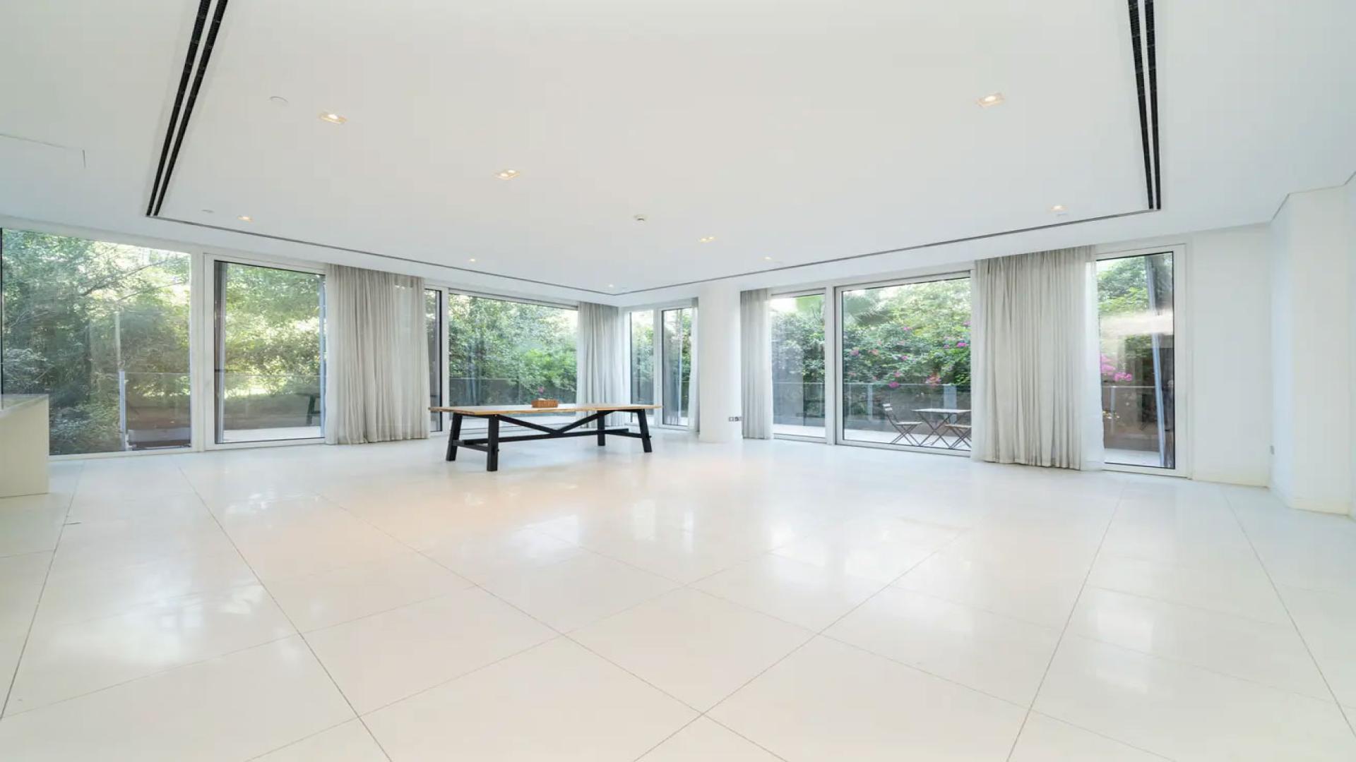 Spacious open-plan kitchen and living area in Al Barari Ashjar apartment for rent