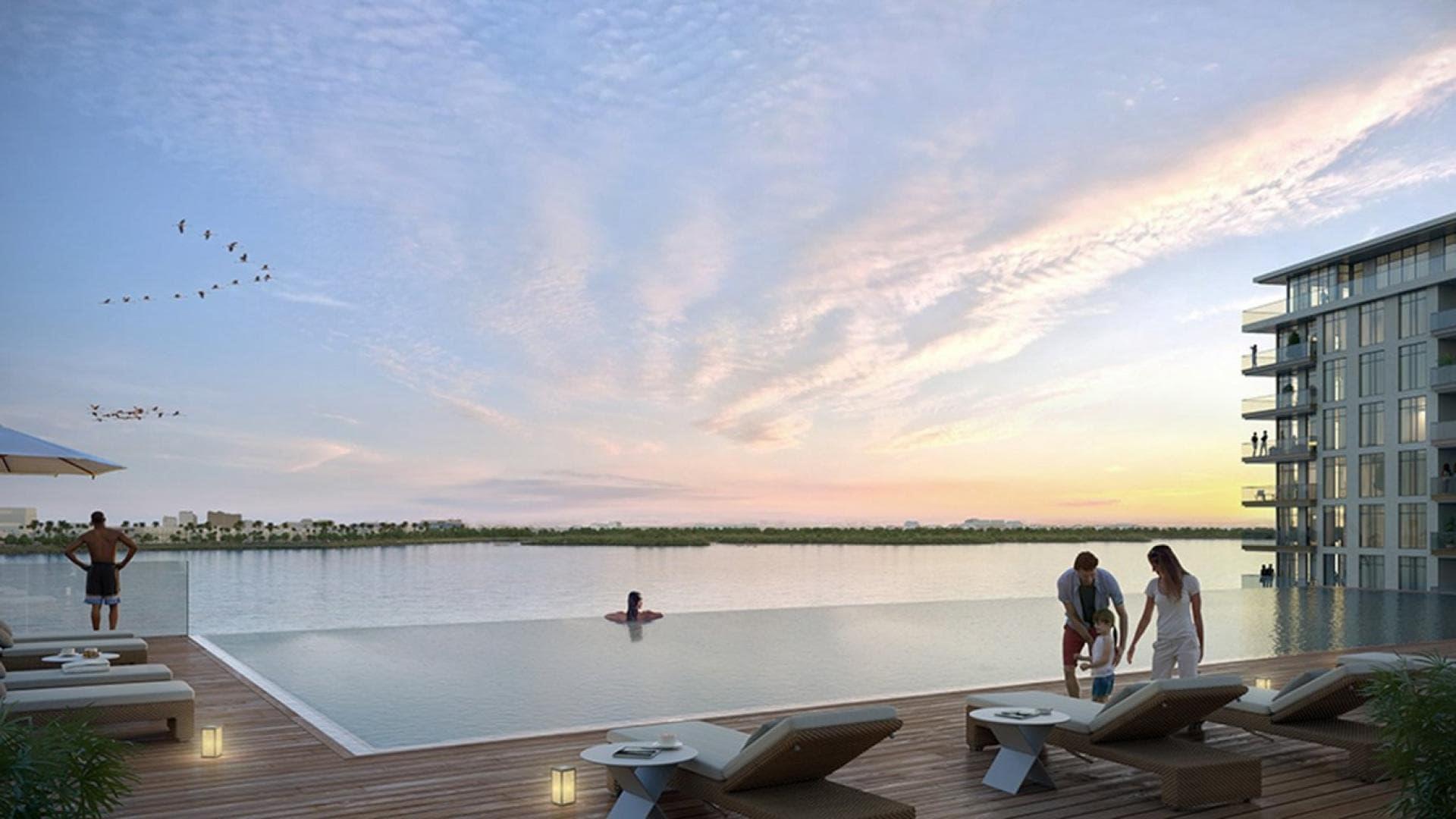 Infinity pool with canal view at The Cove II, Dubai Creek Harbour apartment
