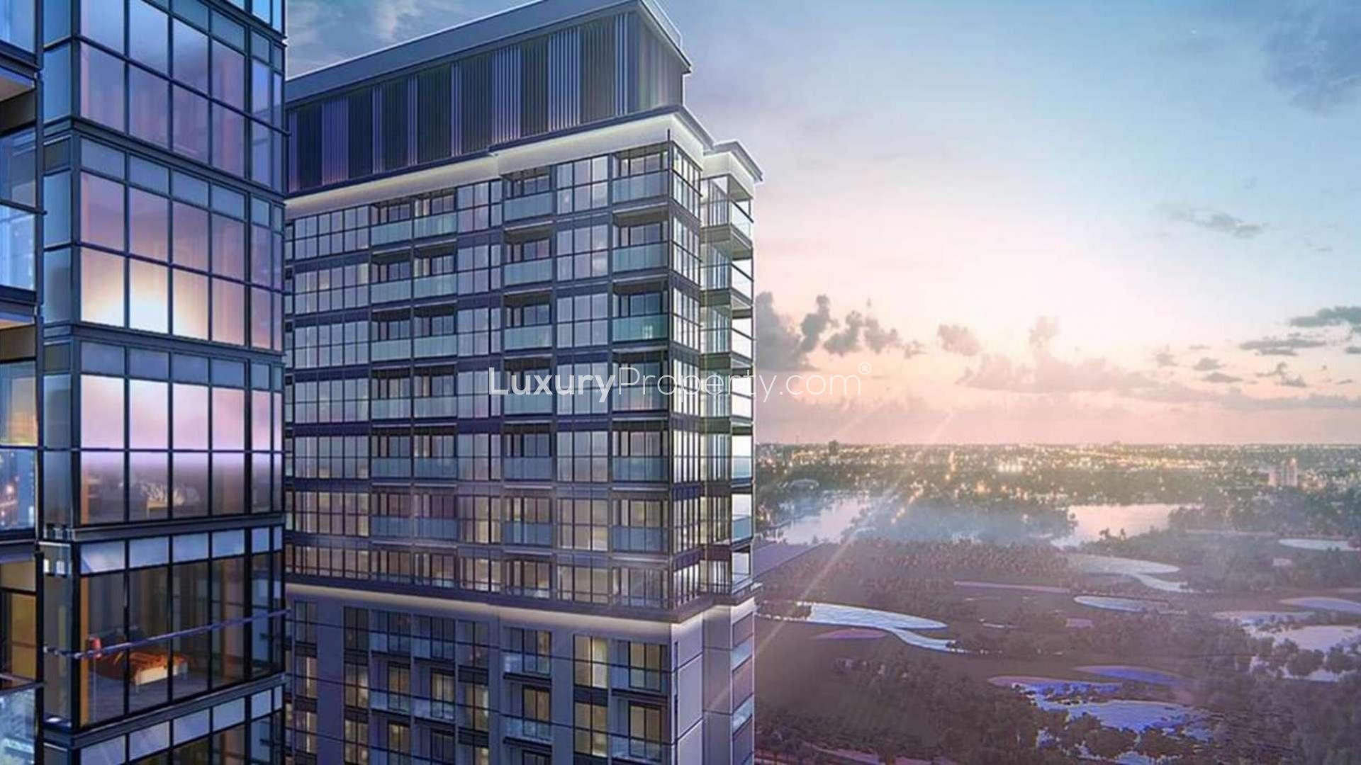 Modern apartment balcony with downtown skyline view at sunset in Sobha Hartland, Dubai