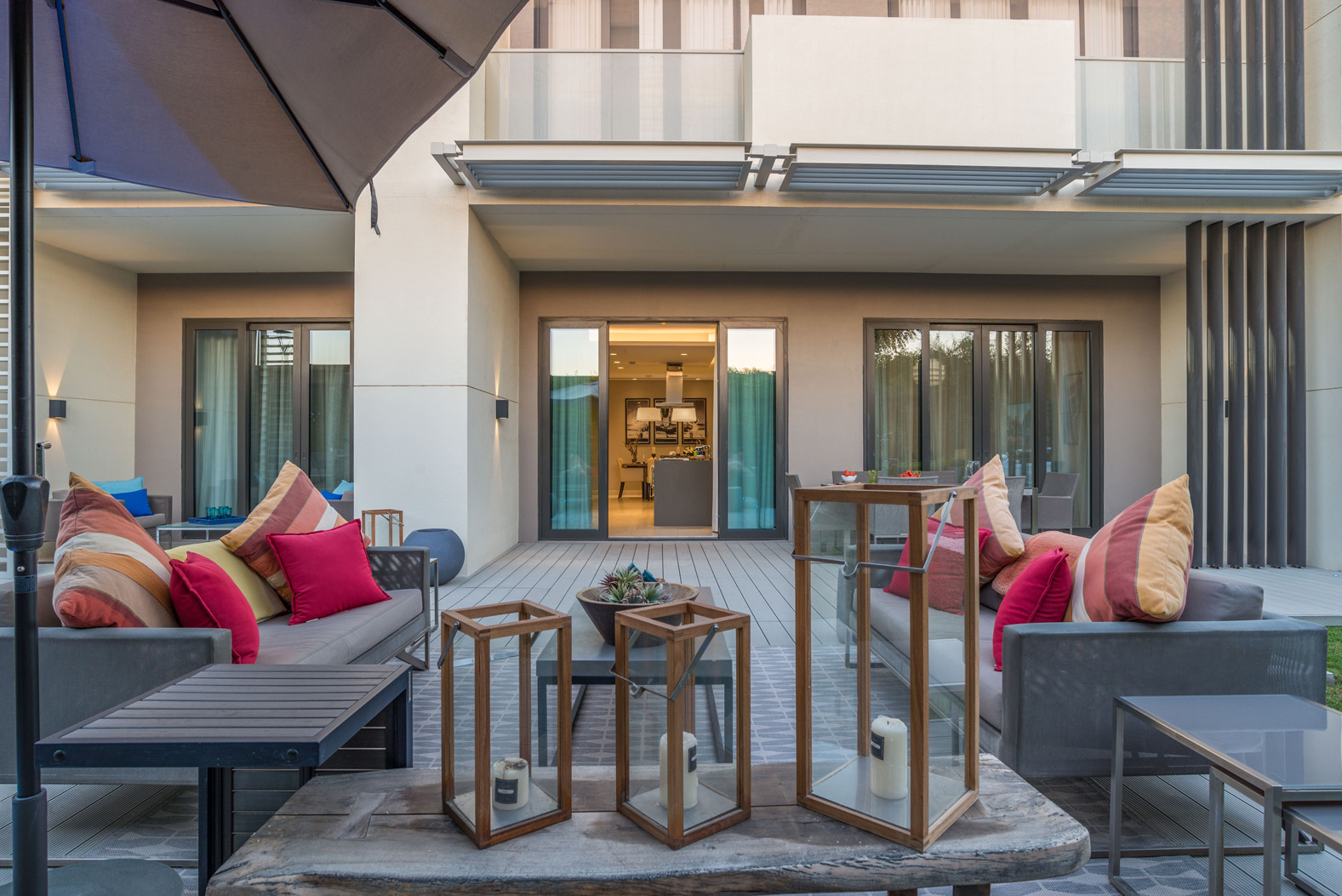 "Modern bedroom in Sobha Hartland Greens apartment, featuring elegant decor and garden view.",Outdoor seating area at Sobha Hartland Greens apartment, Mohammed Bin Rashid City, for sale