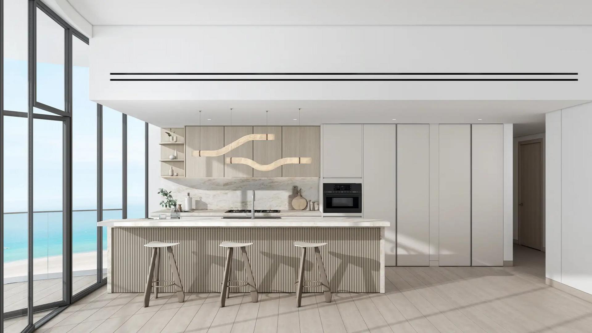 Modern entrance of Ellington Views 2 apartment in Al Hamra Village, palm trees, and golf cart