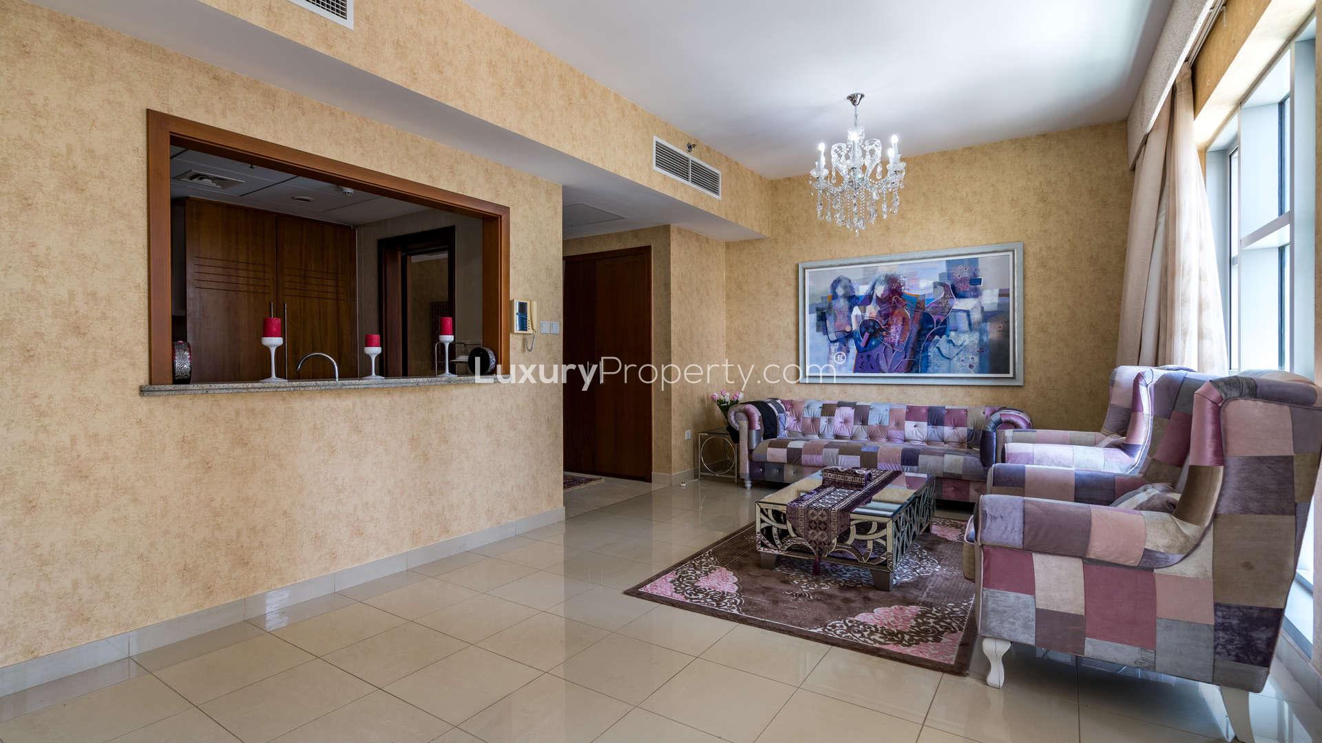Hallway view in Standpoint Towers apartment, Downtown Dubai, with wooden closet and large window