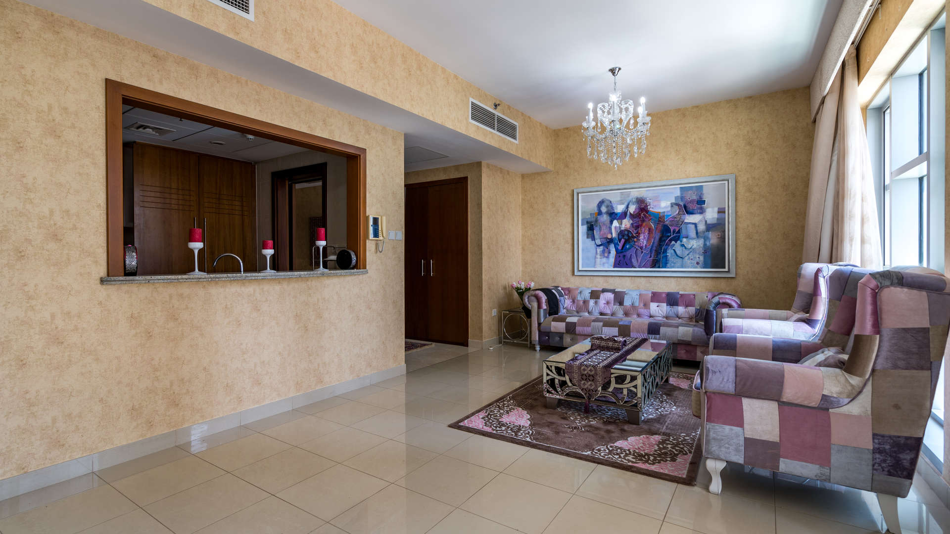 Hallway view in Standpoint Towers apartment, Downtown Dubai, with wooden closet and large window
