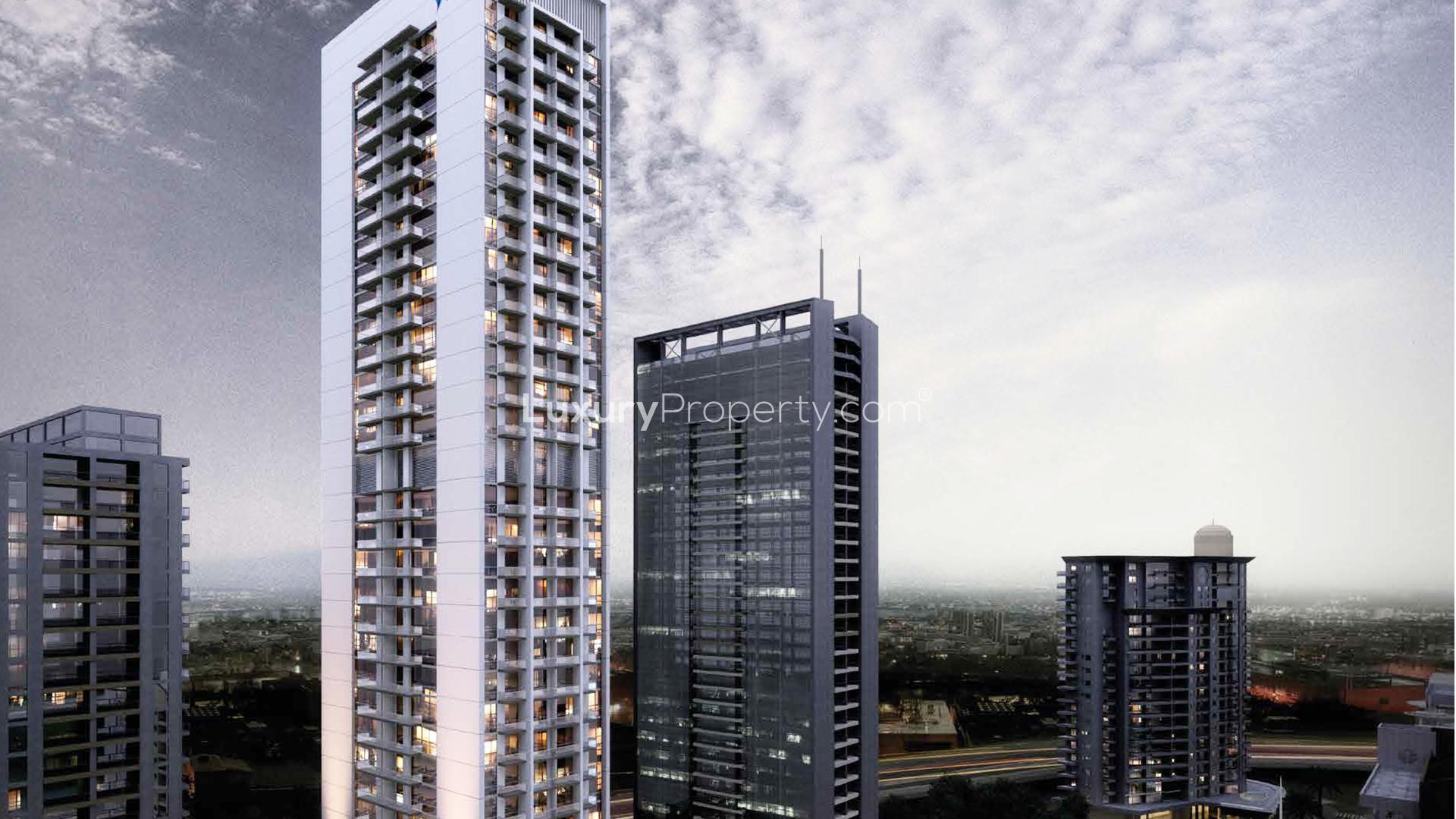 Aerial view of Studio One apartment building with pool in Dubai Marina at night