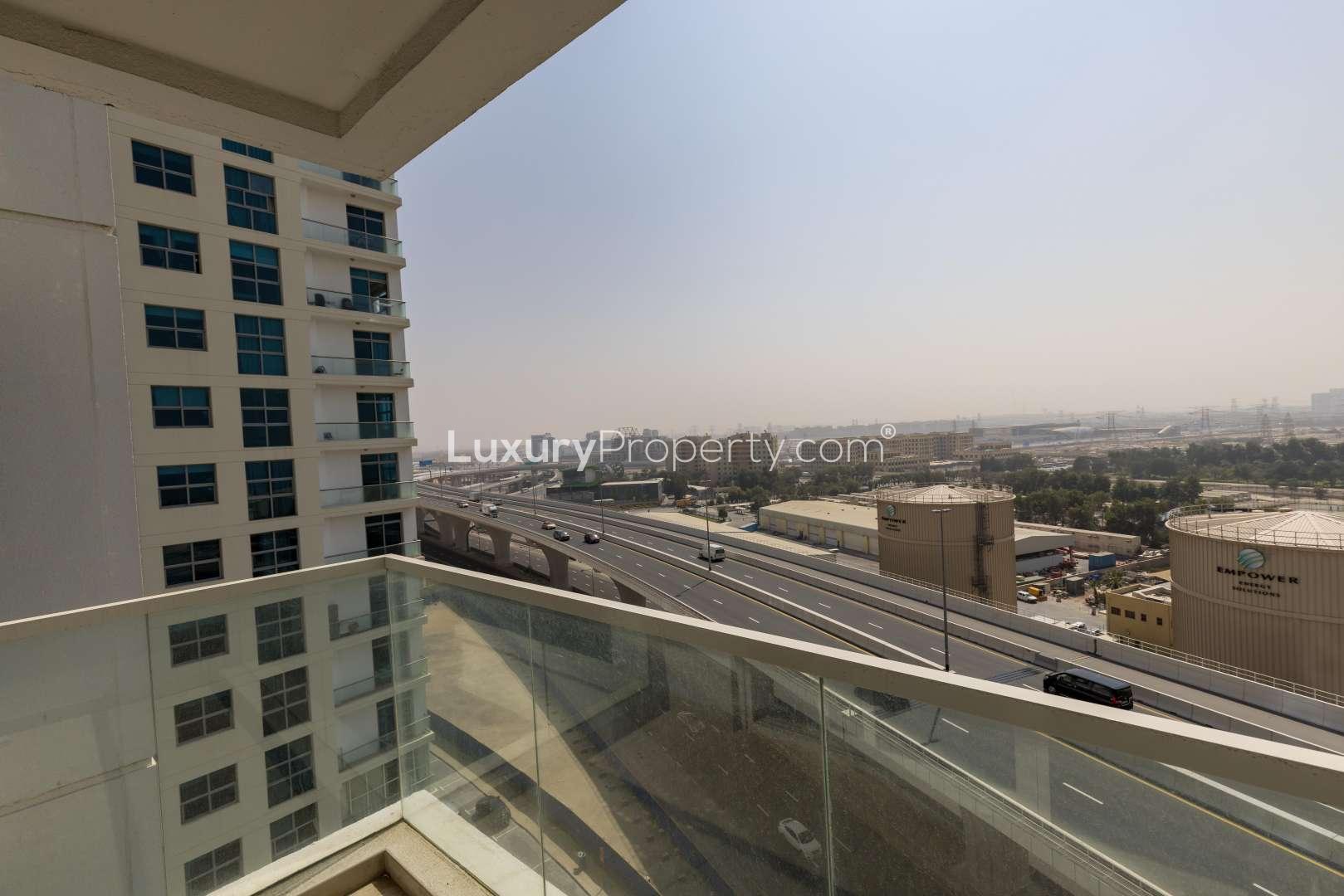 Modern Dubai Marina apartment with open-plan kitchen and large windows overlooking the sea