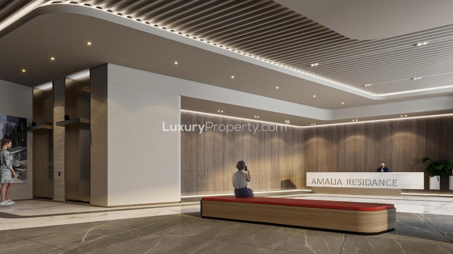 Aerial view of modern Amalia Residences apartment complex with pool in Al Furjan community