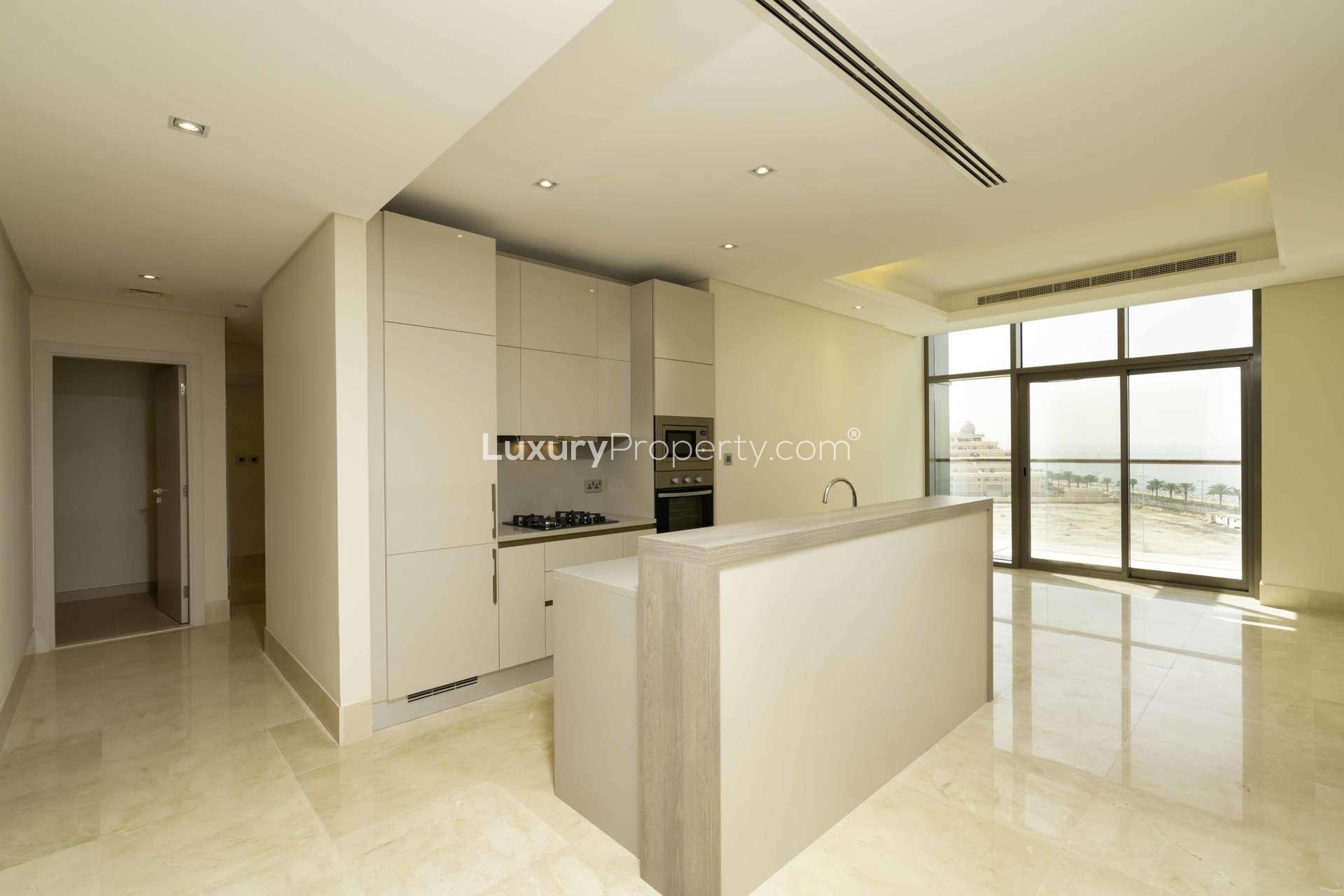 Waterfront view from 2-bedroom apartment balcony in The 8, Palm Jumeirah, Dubai skyline