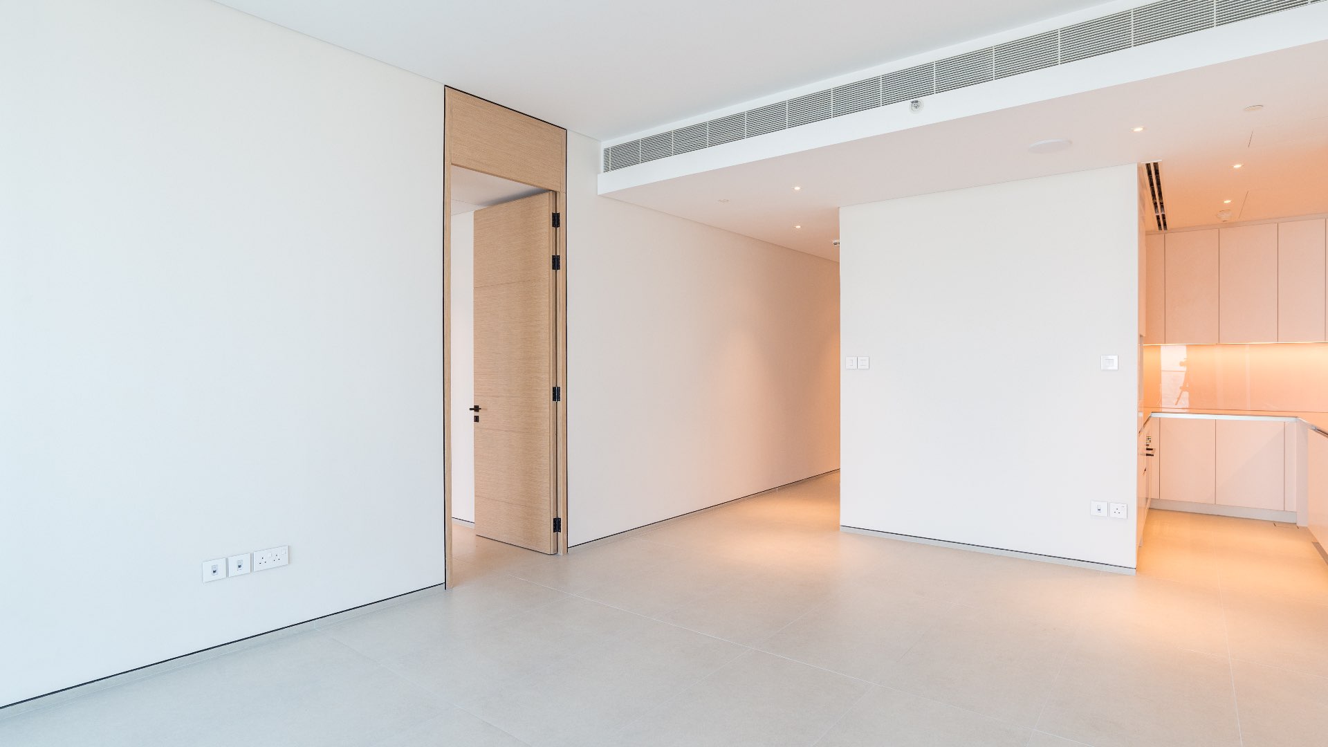 Empty living room with large windows in Jumeirah Beach Residence apartment for sale