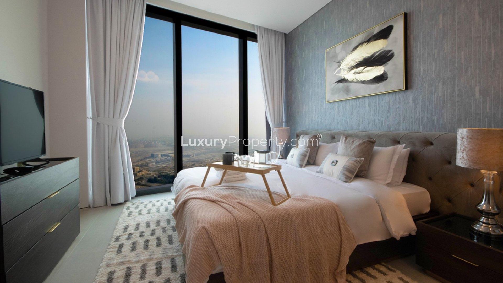 Empty living room and kitchen in Jumeirah Beach Residence apartment for sale