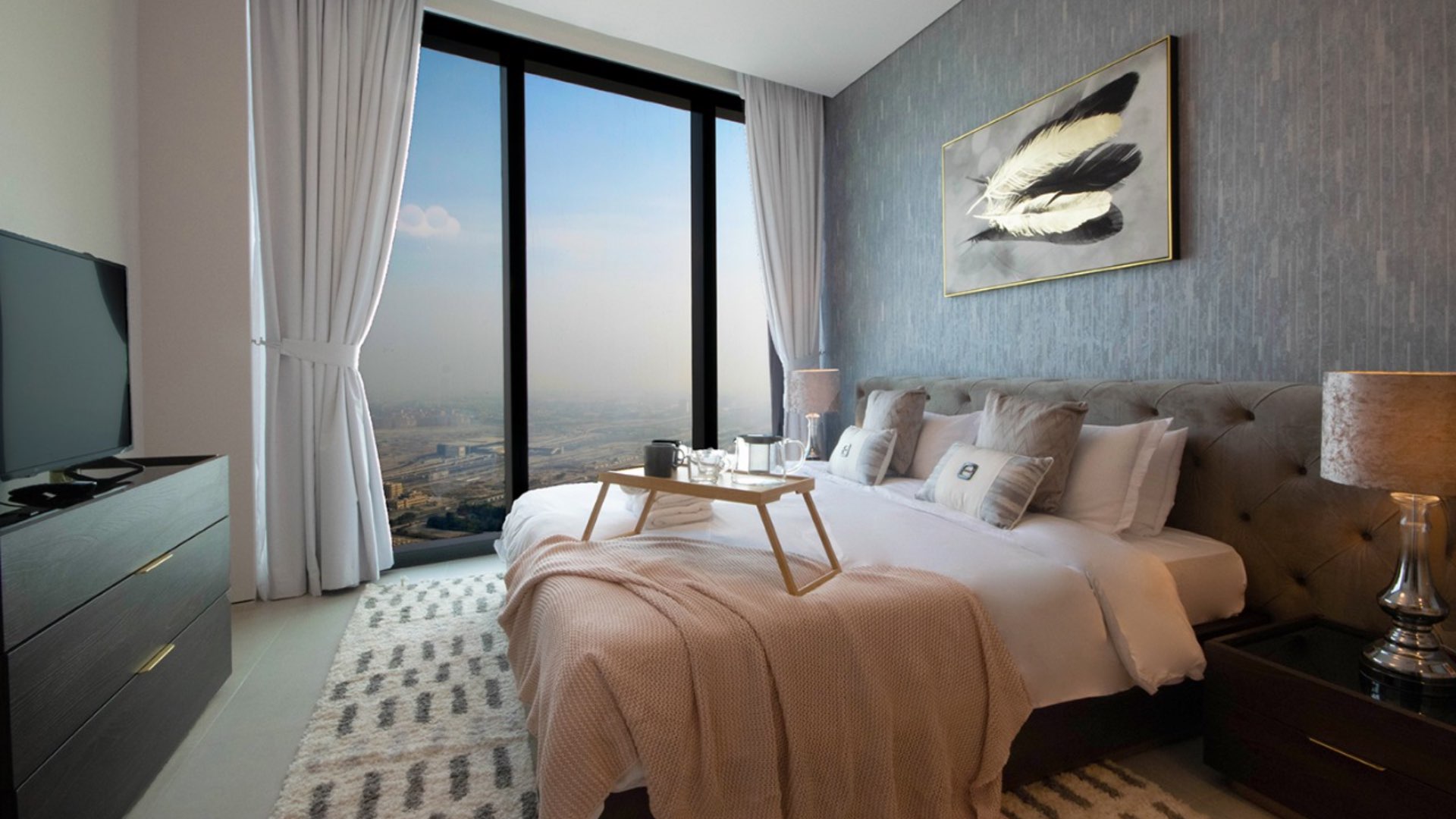 Empty living room and kitchen in Jumeirah Beach Residence apartment for sale