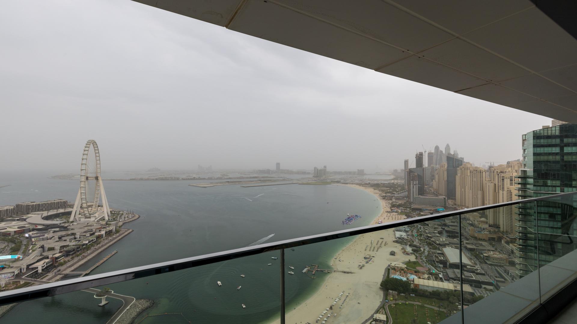 Modern dining area and kitchen in JBR apartment for sale, The Address Jumeirah Resort