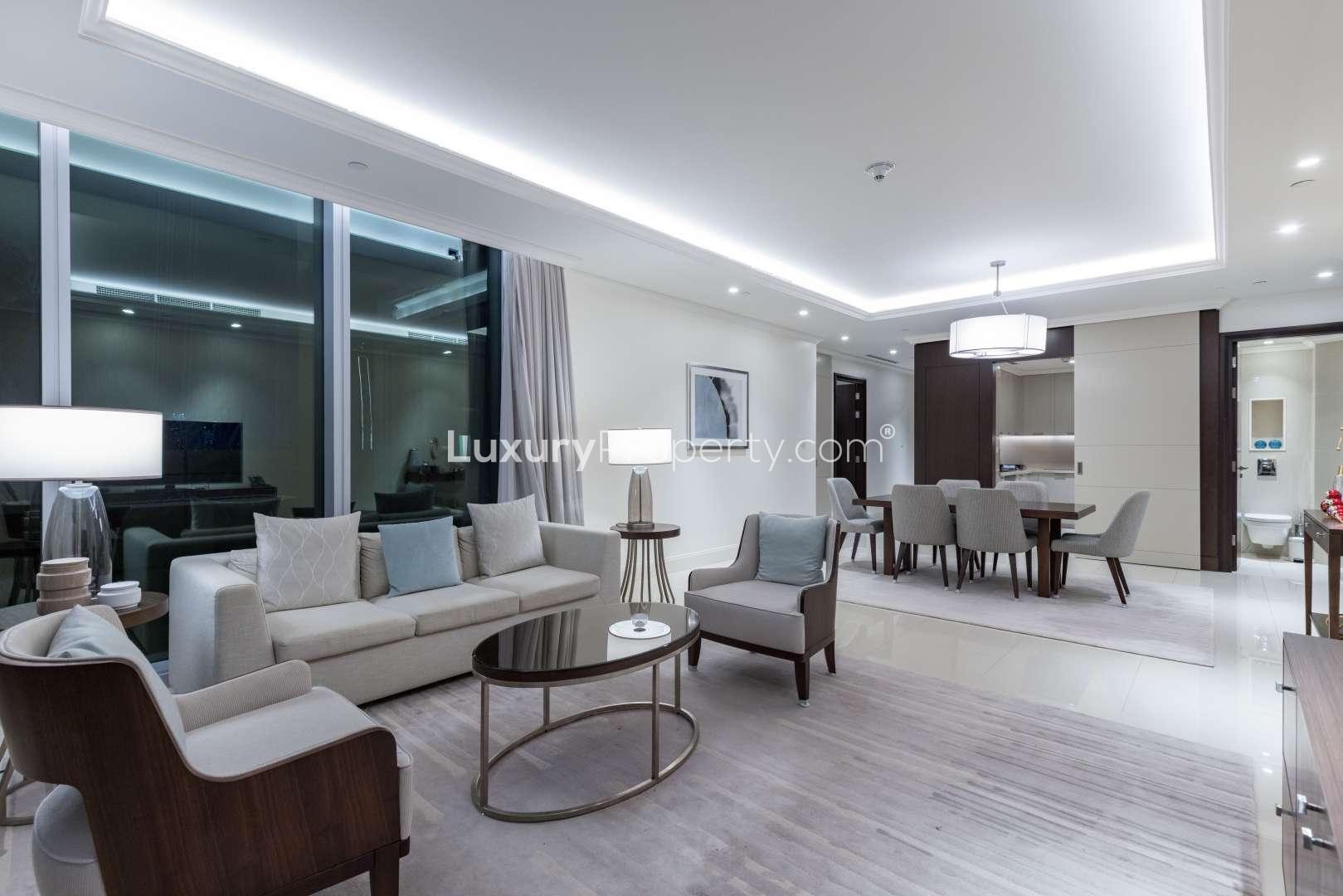 Modern bedroom with city skyline view in Downtown Dubai apartment for sale