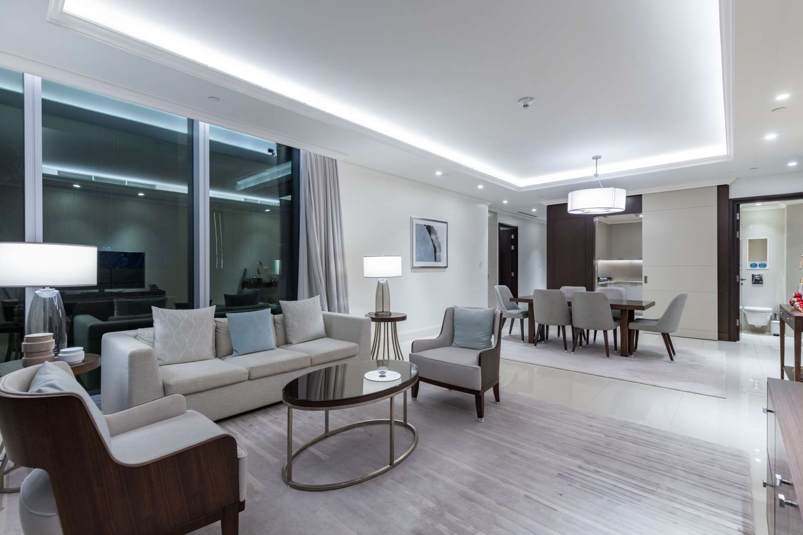 Modern bedroom with city skyline view in Downtown Dubai apartment for sale