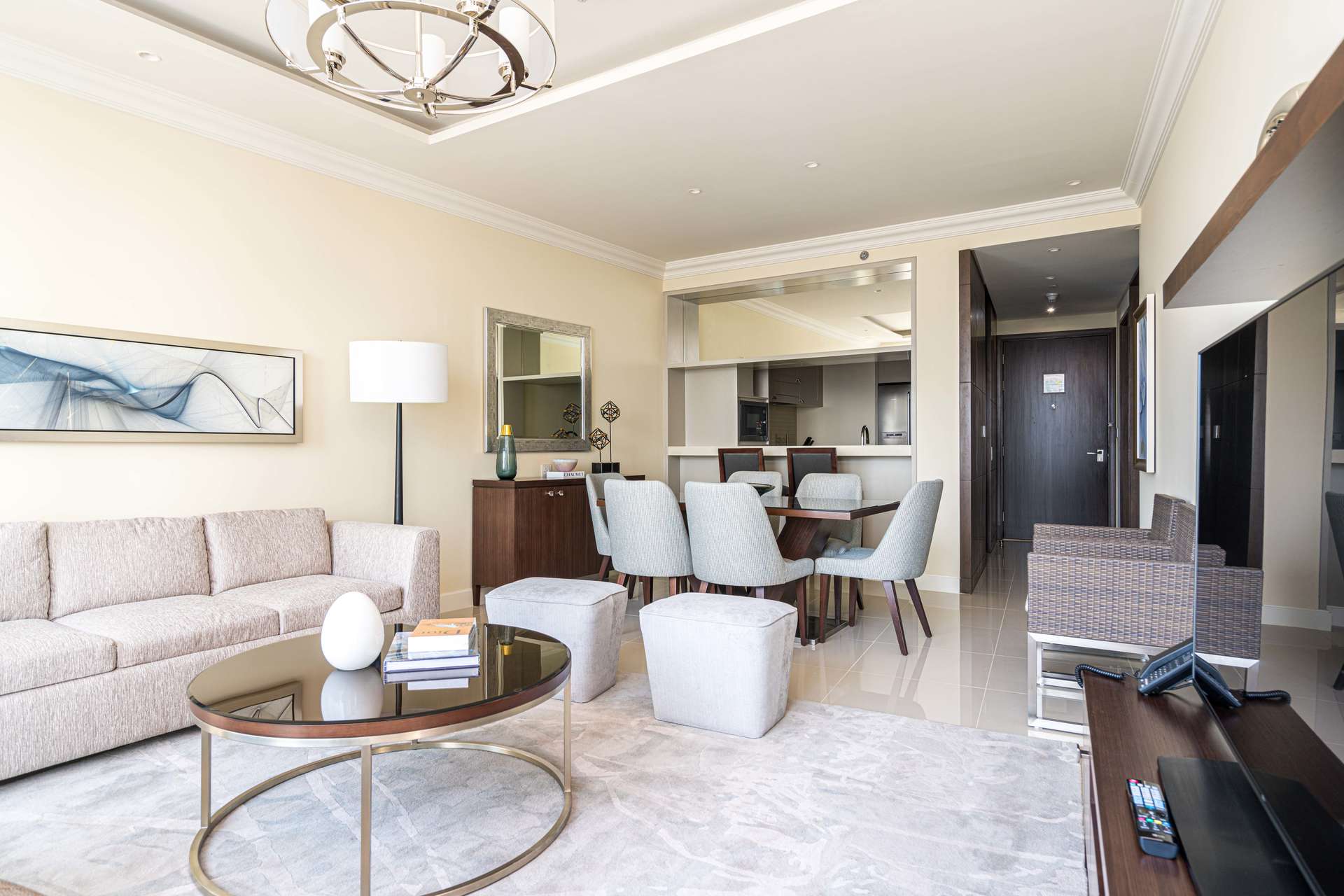 Alt text: "Stunning balcony view from 2-bedroom apartment in Fountain Views, Downtown Dubai, for sale.",Fully furnished living and dining area in 2-bedroom apartment, Fountain Views, Downtown Dubai