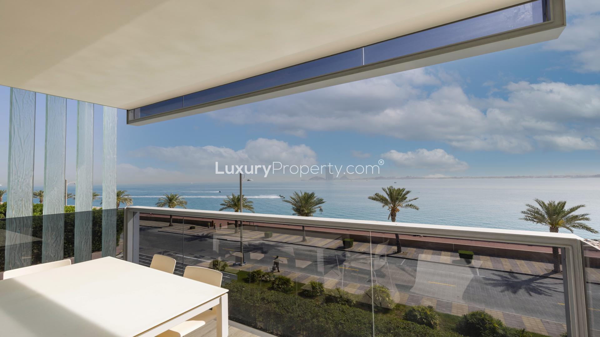 Contemporary furnished living room with sea views in Palm Jumeirah apartment for sale