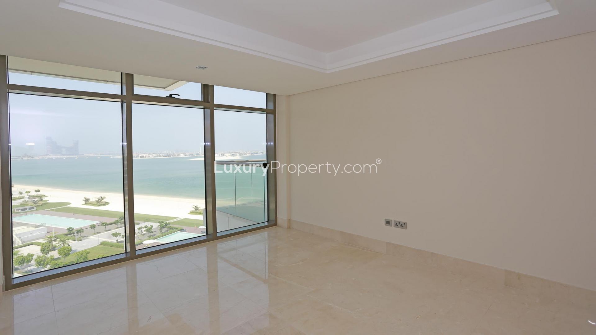 Stylish Palm Jumeirah apartment with sea view, lush gardens, and pool in The Crescent