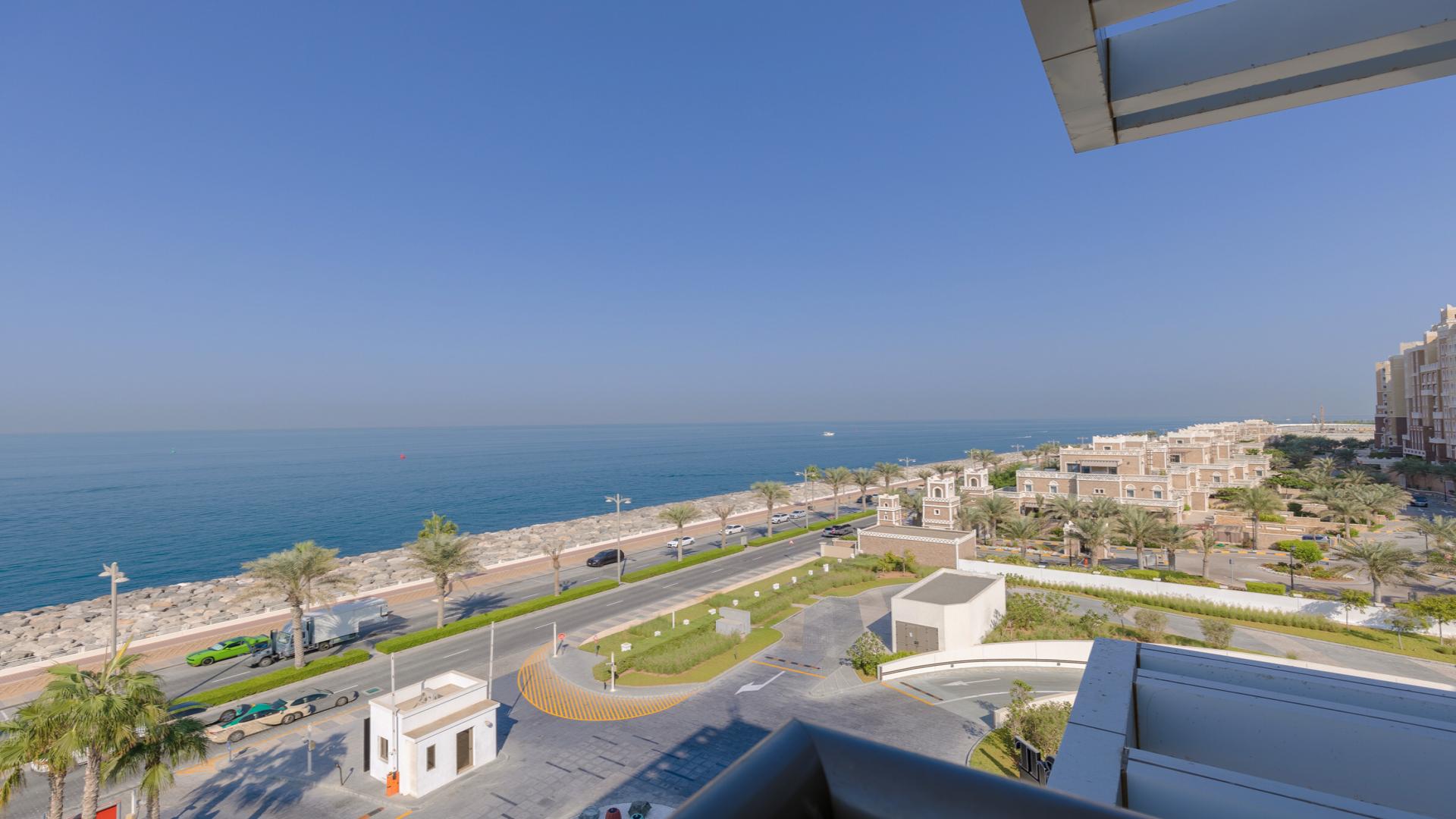 "Palm Jumeirah apartment balcony with full sea view, designer furniture, and modern upgrades.","Stunning sea view from Palm Jumeirah apartment, The Crescent, for sale, LP13993.",Modern bathroom with black marble tiles in Palm Jumeirah apartment, LP13993, The Crescent