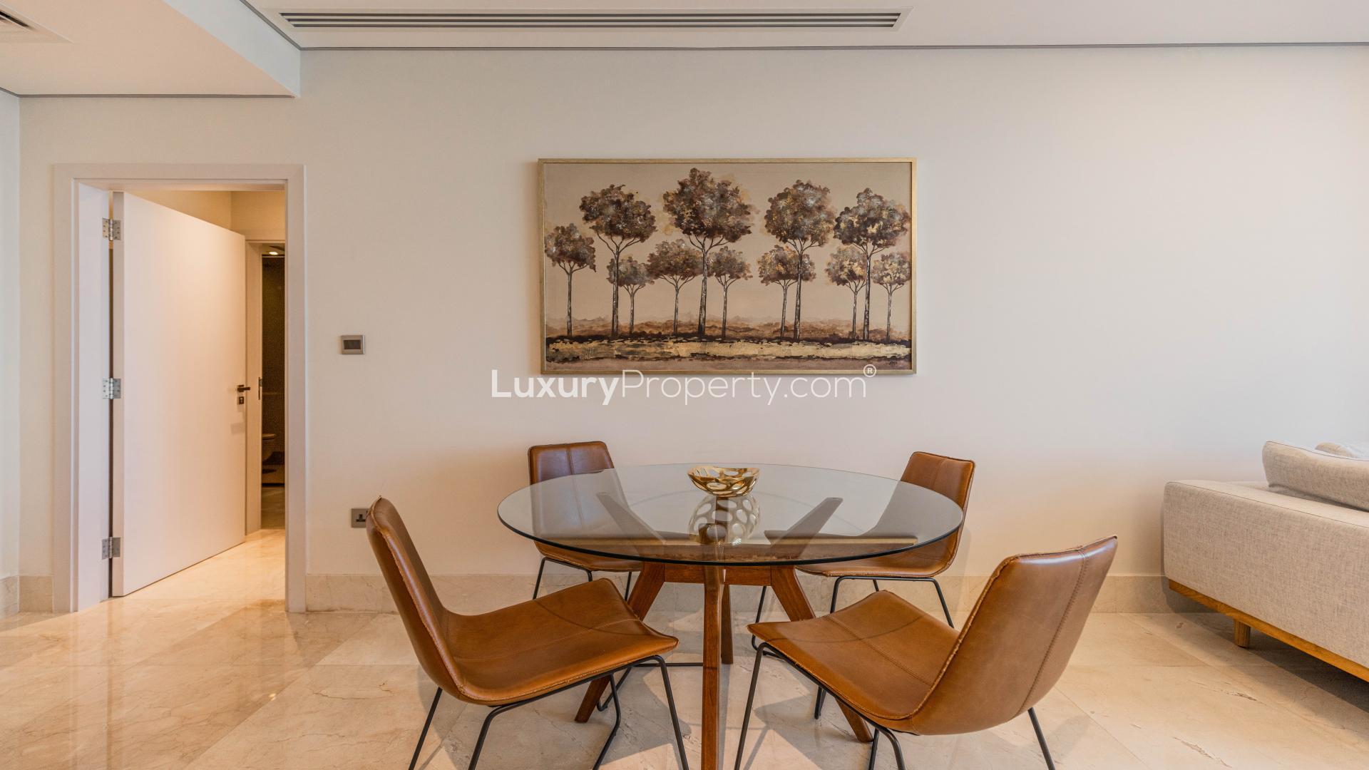 Beachfront apartment balcony view, showcasing sea and Burj Al Arab, Palm Jumeirah