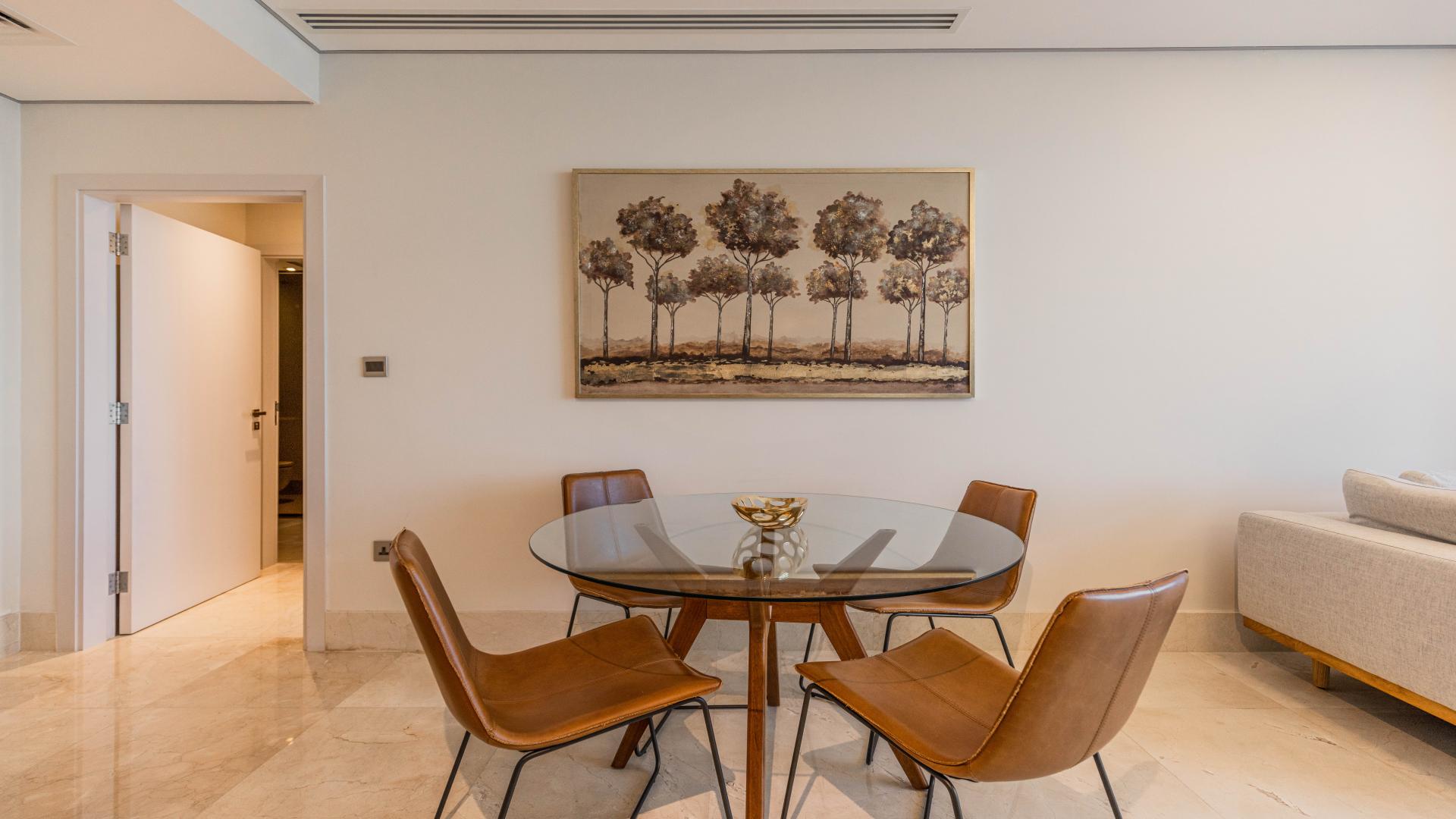 Beachfront apartment balcony view, showcasing sea and Burj Al Arab, Palm Jumeirah