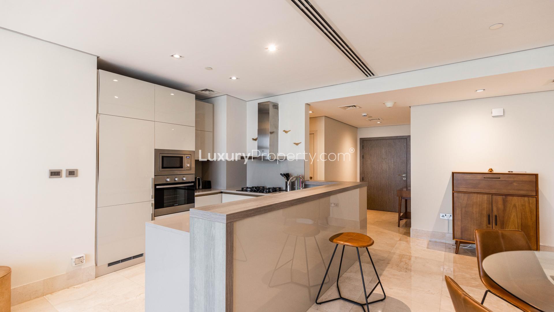 Modern kitchen in luxury beachfront apartment, Palm Jumeirah, with sleek design and high-end appliances