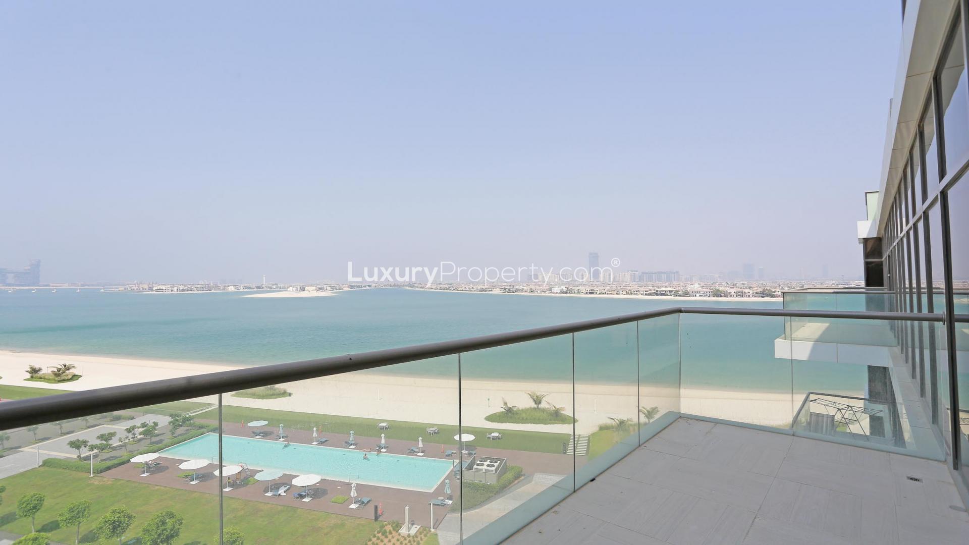 High-floor apartment view, Palm Jumeirah, showcasing skyline and sea, lush gardens, luxury amenities