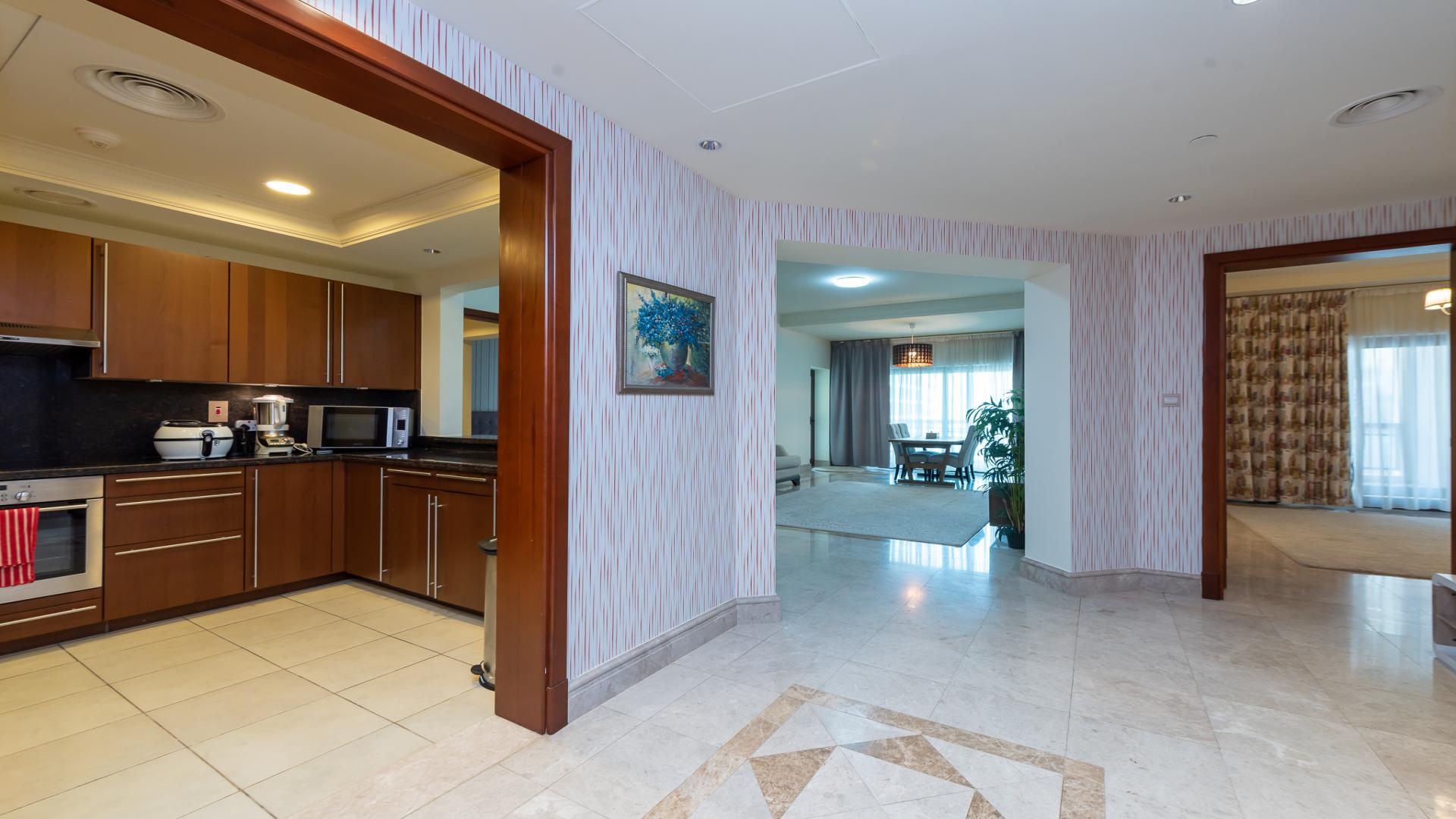 Living room in 2-bedroom apartment, Fairmont South, Palm Jumeirah, featuring modern decor and dining area