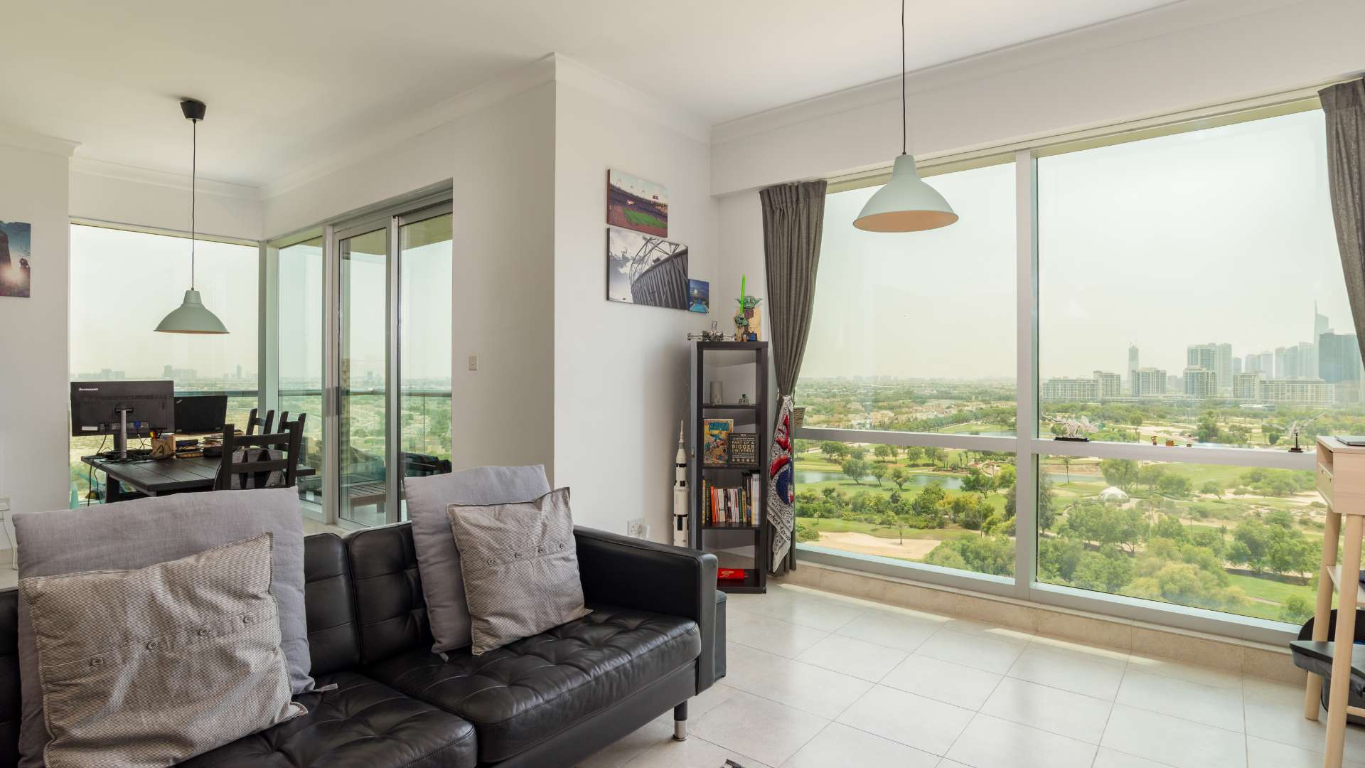 Kitchen with modern cabinets and city view in The Fairways apartment, The Views