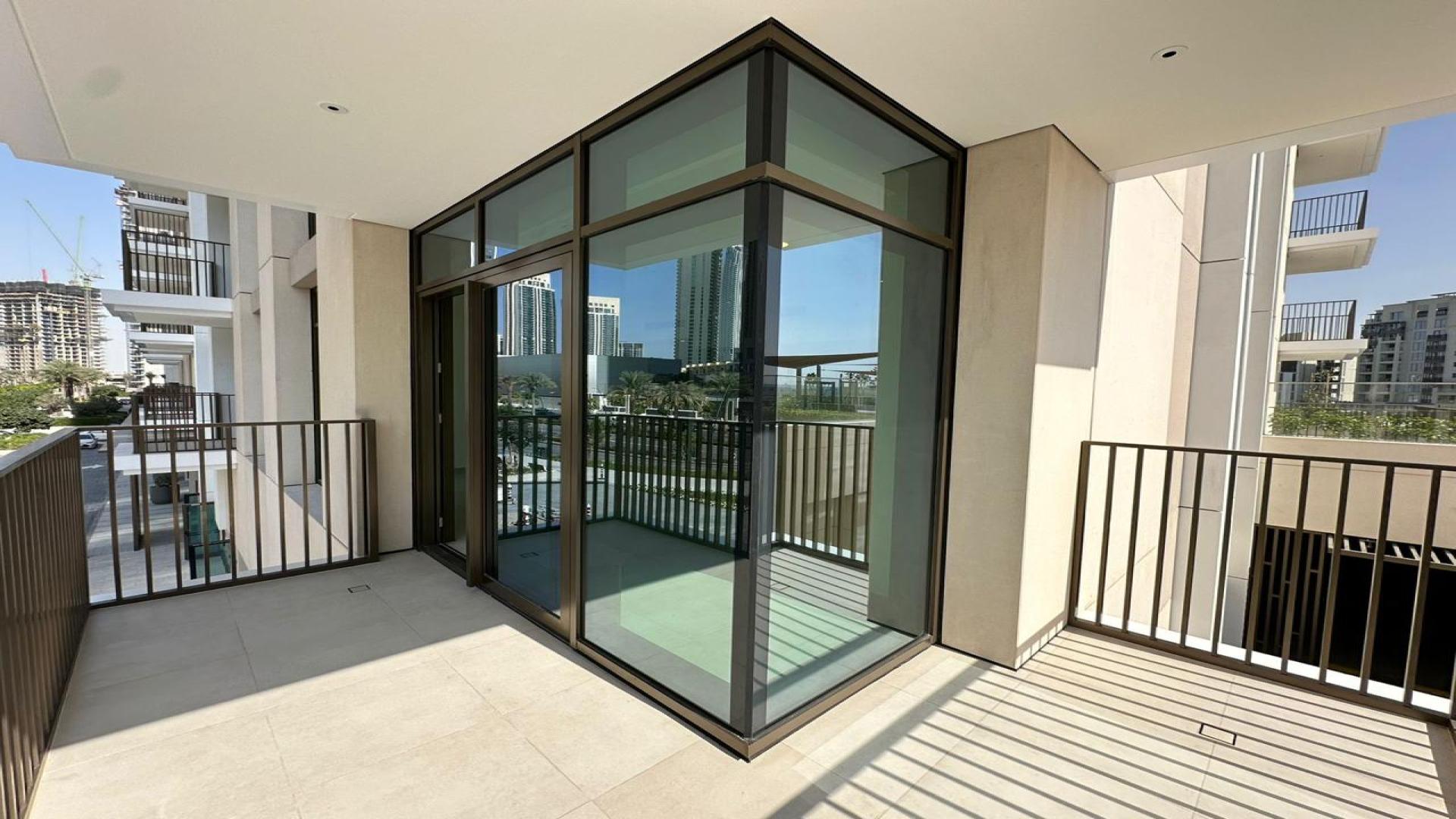 Bright living area with large windows in Creek Palace apartment, Dubai Creek Harbour