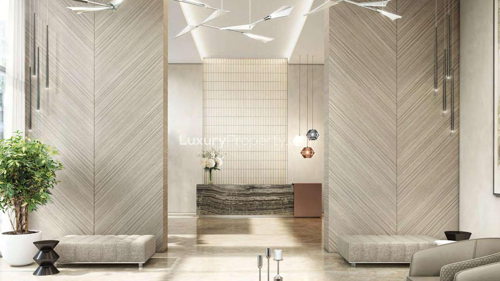 "Stunning view of The Grand, Dubai Creek Harbour skyline with iconic architecture at sunset.",Luxurious lobby interior of waterfront apartment at The Grand, Dubai Creek Harbour