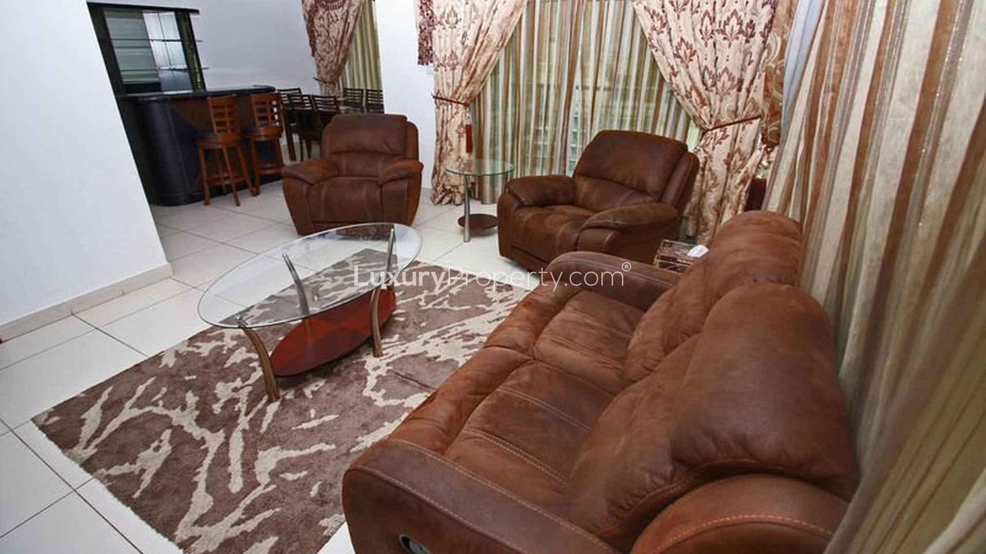 Elegant living room in 2-bedroom apartment, The Lofts, Downtown Dubai, featuring luxurious furnishings